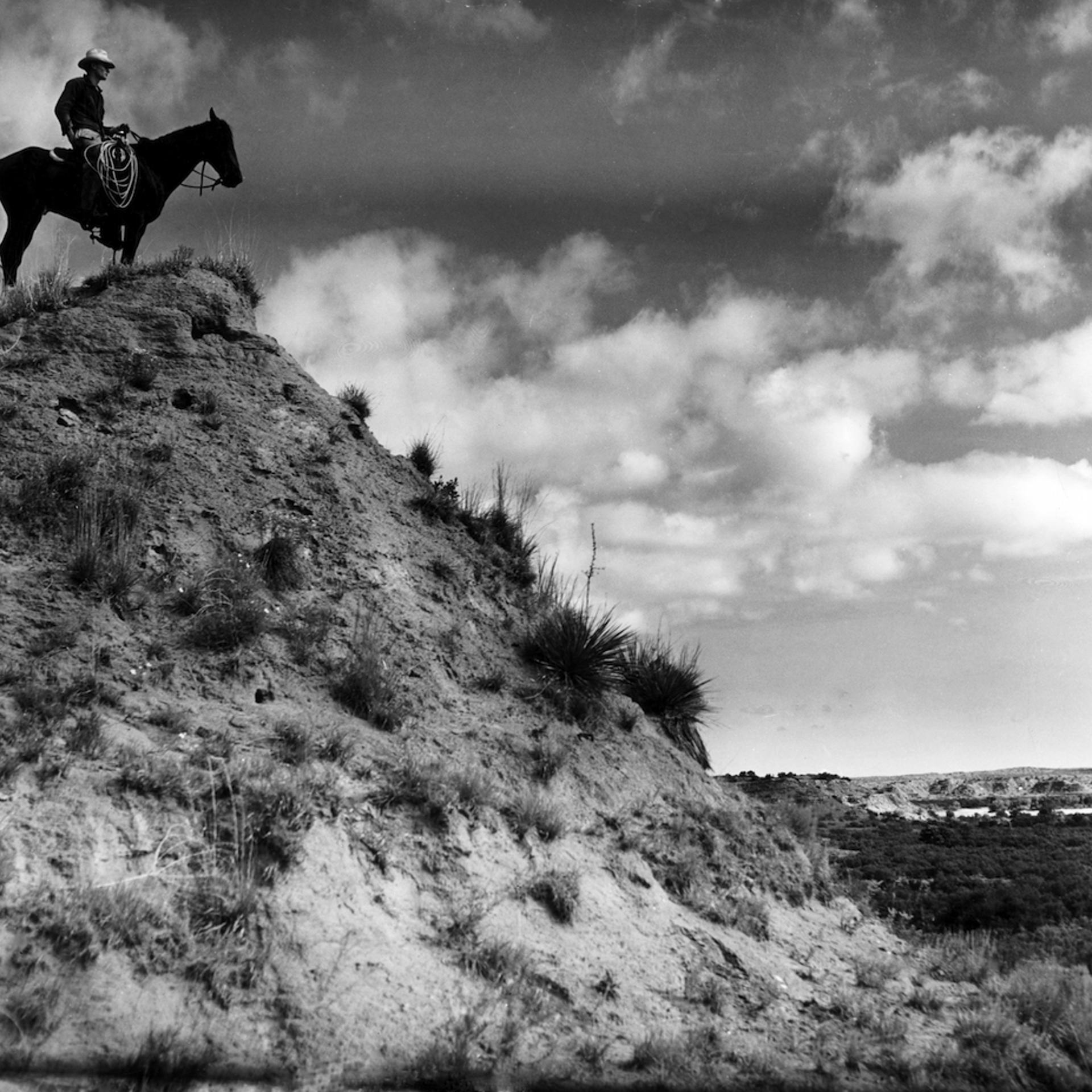 Cowboy on horseback at the Matador Ranch