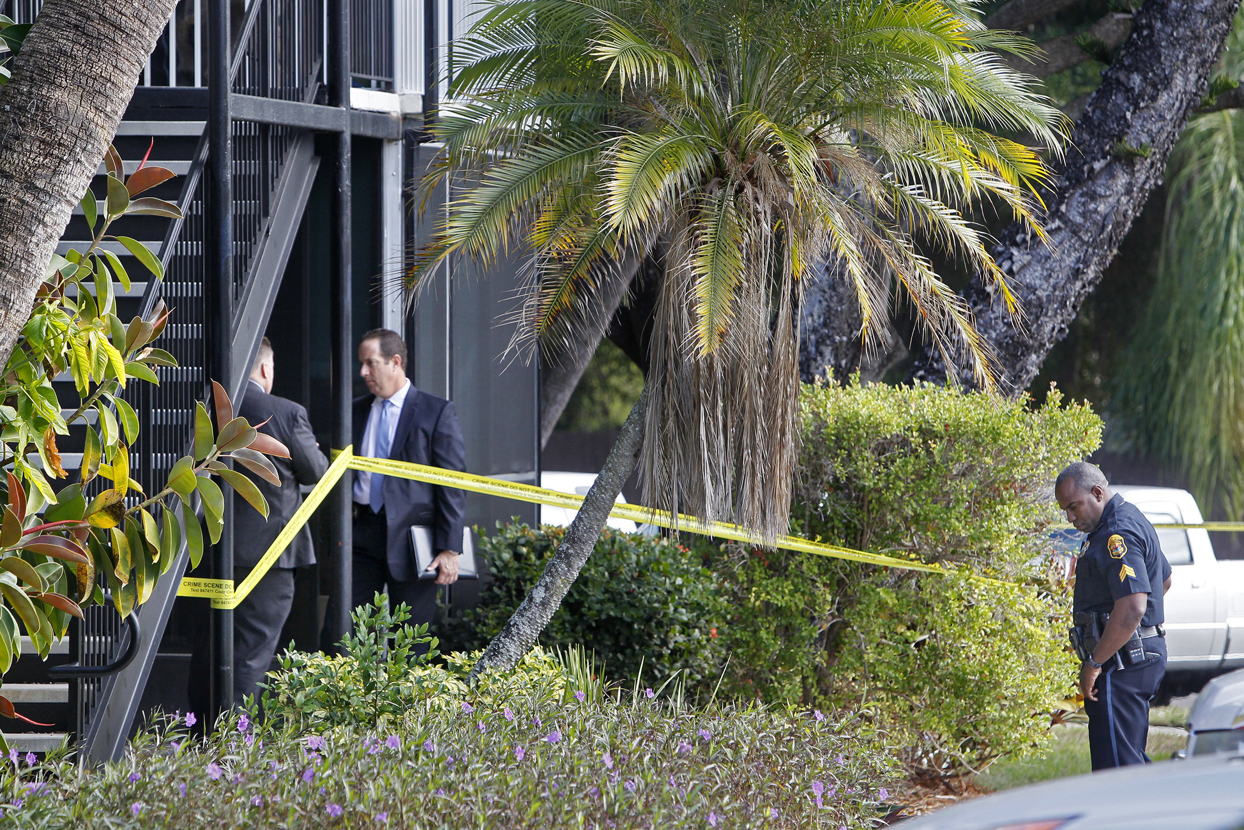 Clearwater police stand outside the apartment where a 10-year-old boy was fatally shot in his home on Jan. 5, 2017, in Clearwater, Fla.