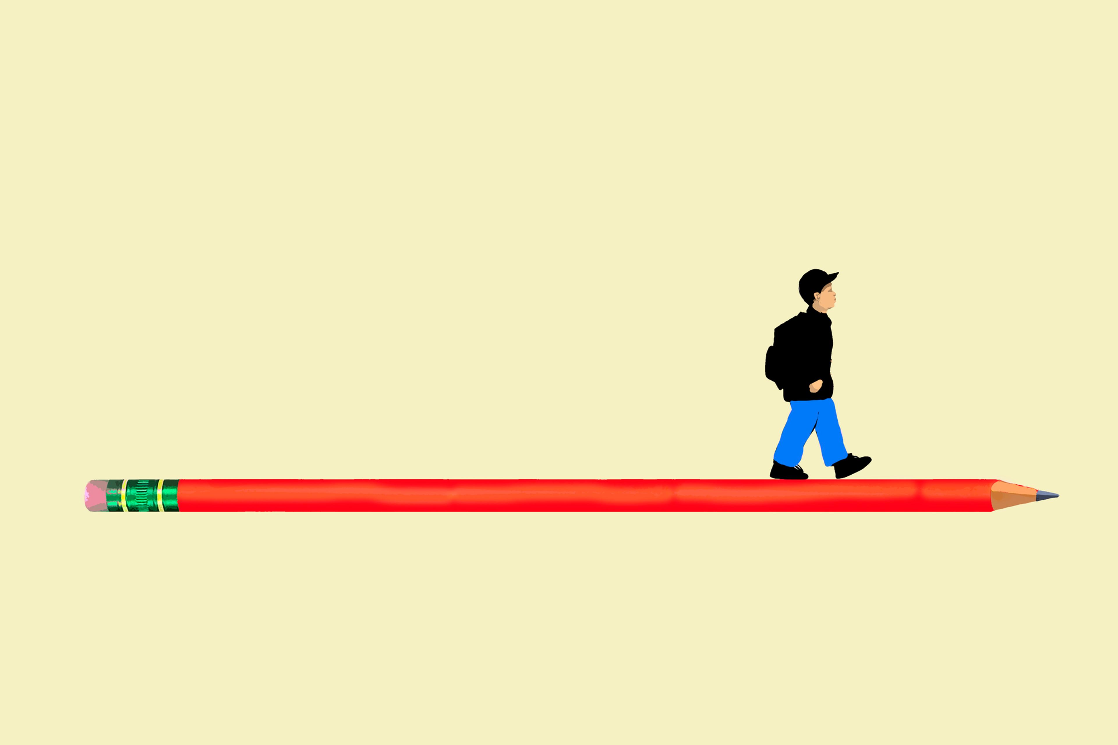 Schoolboy walking on oversized pencil