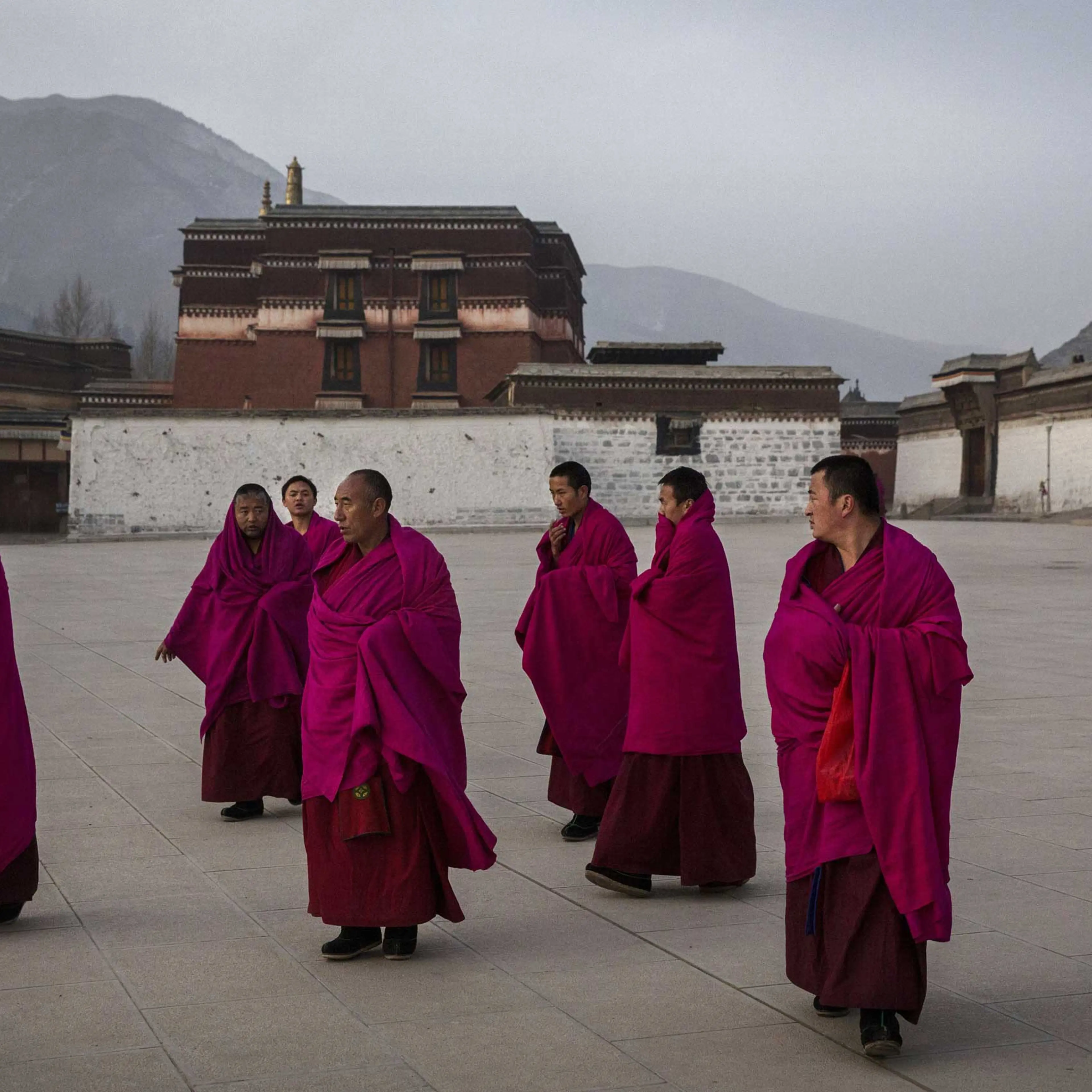 Tibetan Buddhist Monks of the Gelug, or Yellow Hat order, leave morning prayers during Monlam or the Great Prayer rituals on March 3, 2015 at the Labrang Monastery, Xiahe County, Amdo, Tibetan Autonomous Prefecture, Gansu Province, China.