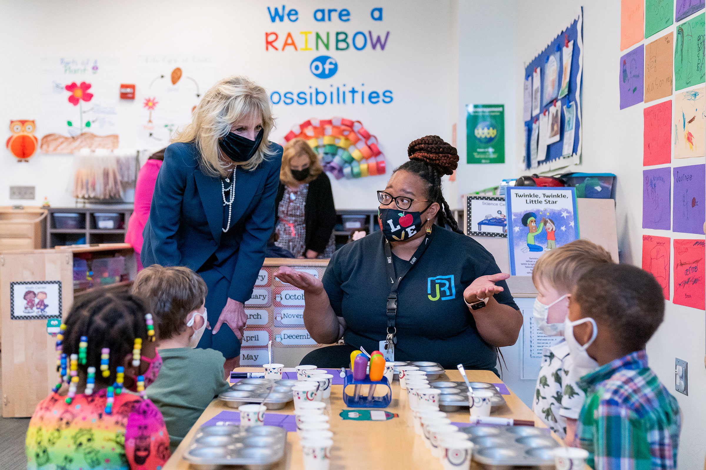 Biden with a Head Start teacher and children in Alabama in 2021