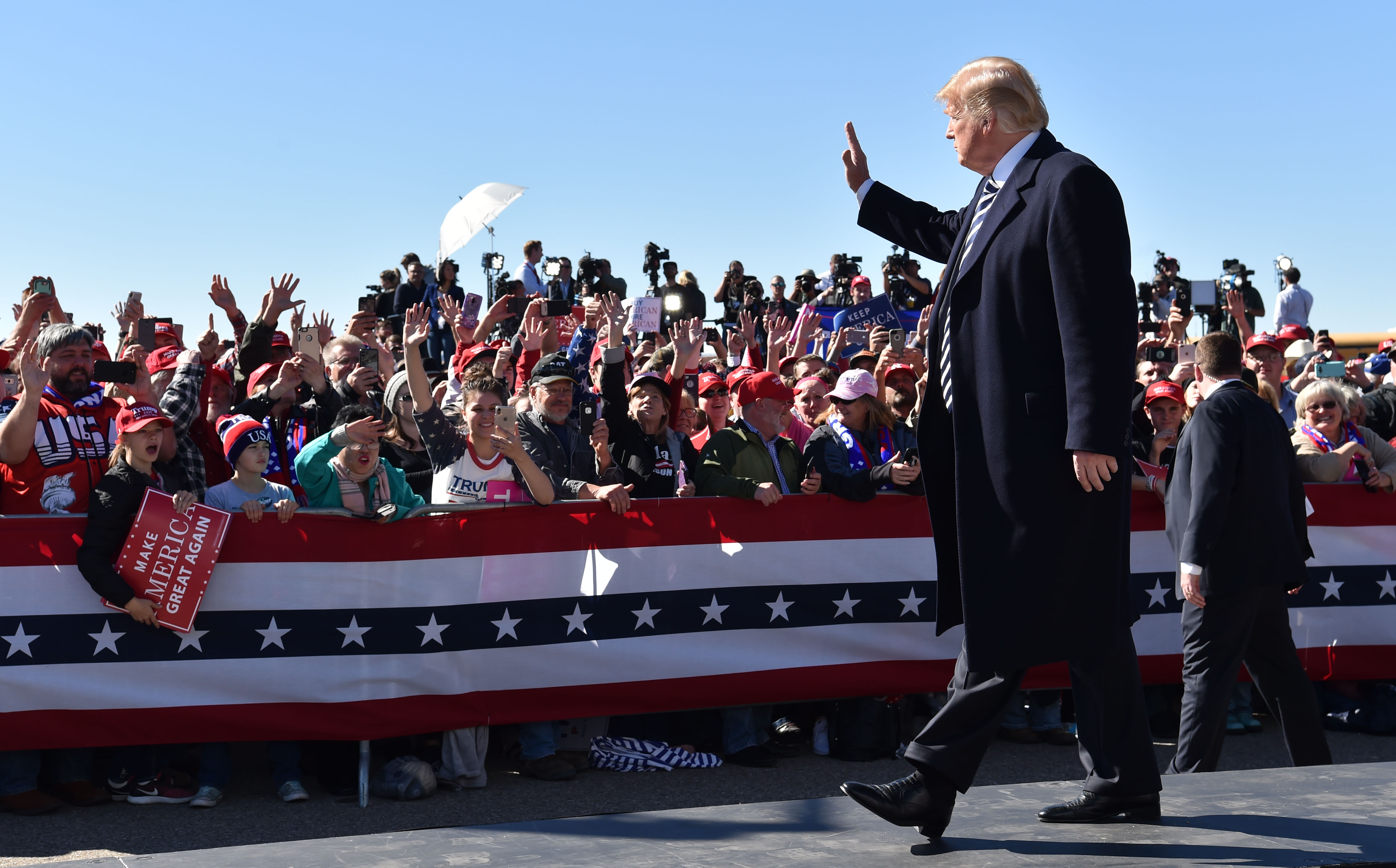 US President Donald Trump arrives for a "Make America Great Again" rally at Elko Regional Airport