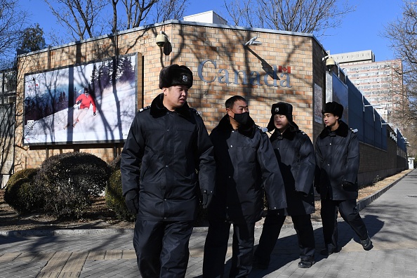 Chinese police patrol in front of the Canadian embassy in Beijing on December 13, 2018. - A second Canadian who had gone missing in China is under investigation on suspicion of "engaging in activities that harm China's national security", state media rep