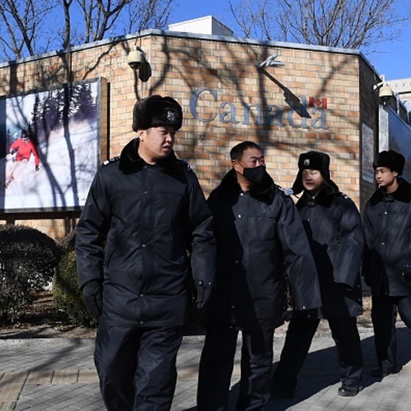 Chinese police patrol in front of the Canadian embassy in Beijing on December 13, 2018. - A second Canadian who had gone missing in China is under investigation on suspicion of "engaging in activities that harm China's national security", state media rep