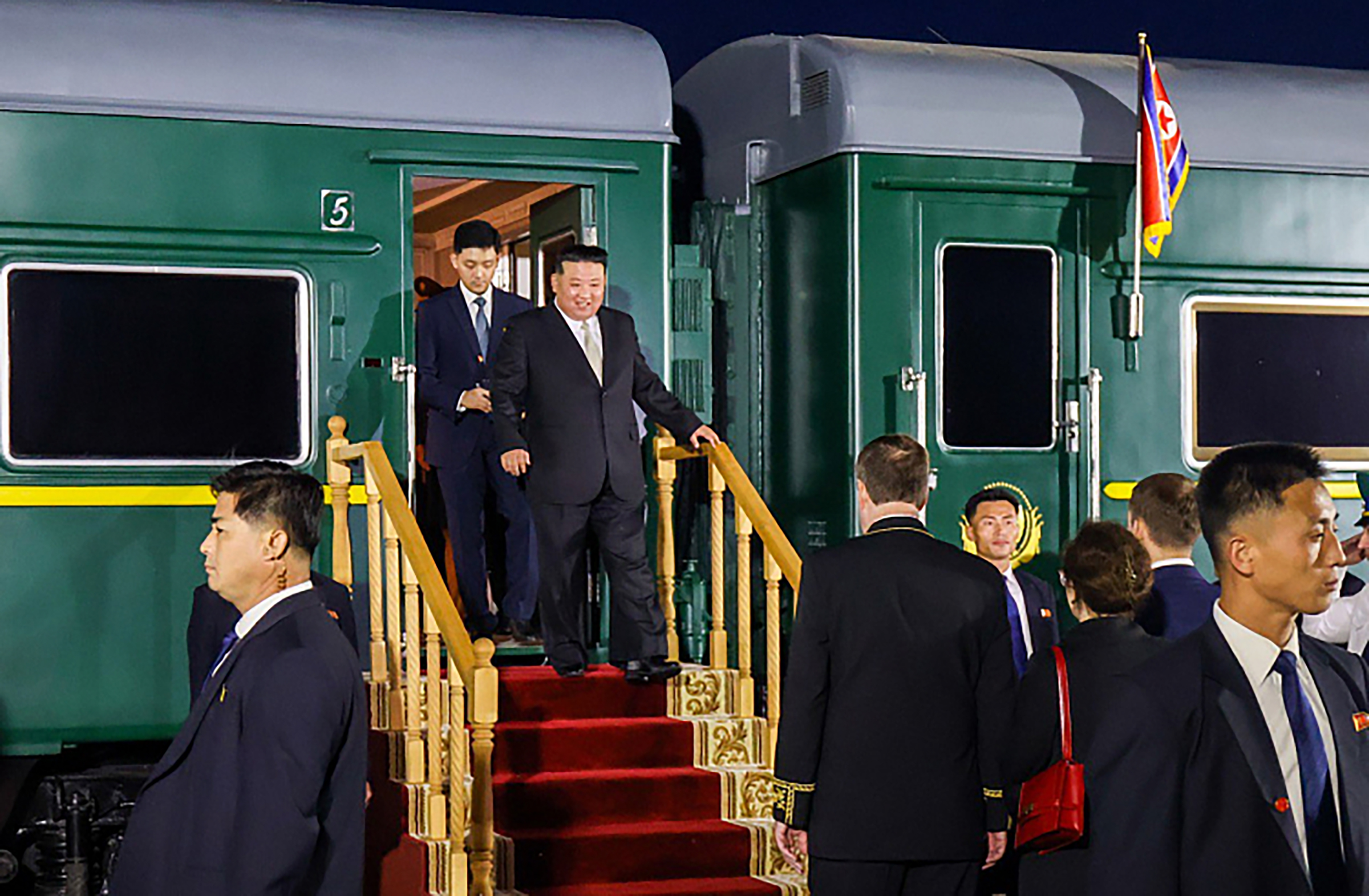 North Korea leader Kim Jong Un is welcomed by Minister of Natural Resources and Ecology of Russia Alexander Kozlov after arriving at Vladivostok by armored train to attend a meeting with Russian President Vladimir Putin (not seen) in Vladivostok, Russia, on Sept. 12.
