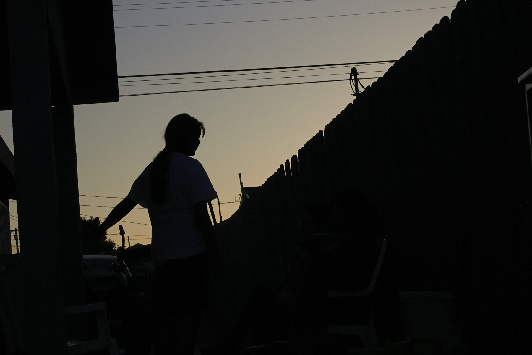  At dusk in Los Angeles, Maria, 15, waits for word on 
her plea for asylum from extortion and gang threats in El Salvador. 