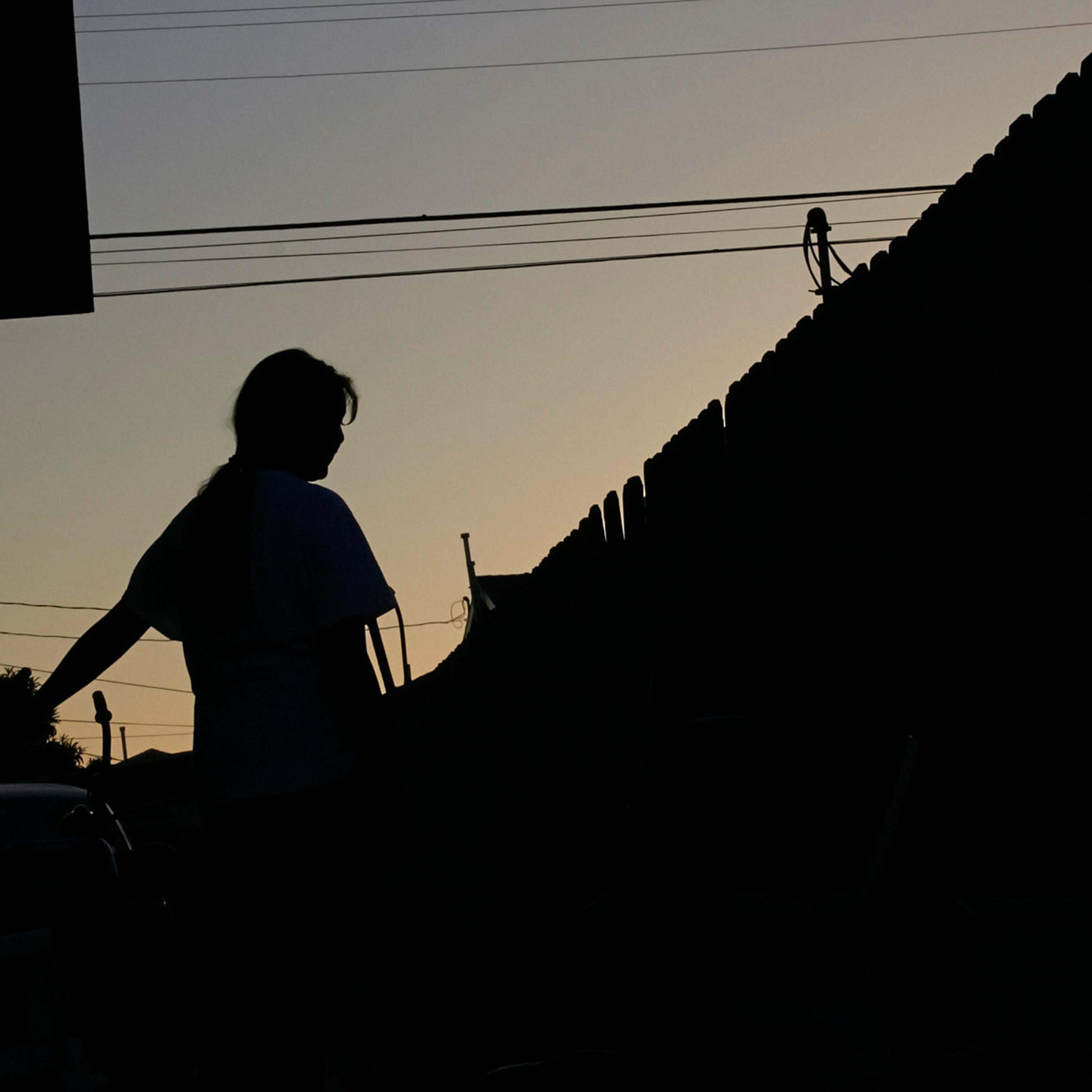 At dusk in Los Angeles, Maria, 15, waits for word on
her plea for asylum from extortion and gang threats in El Salvador.