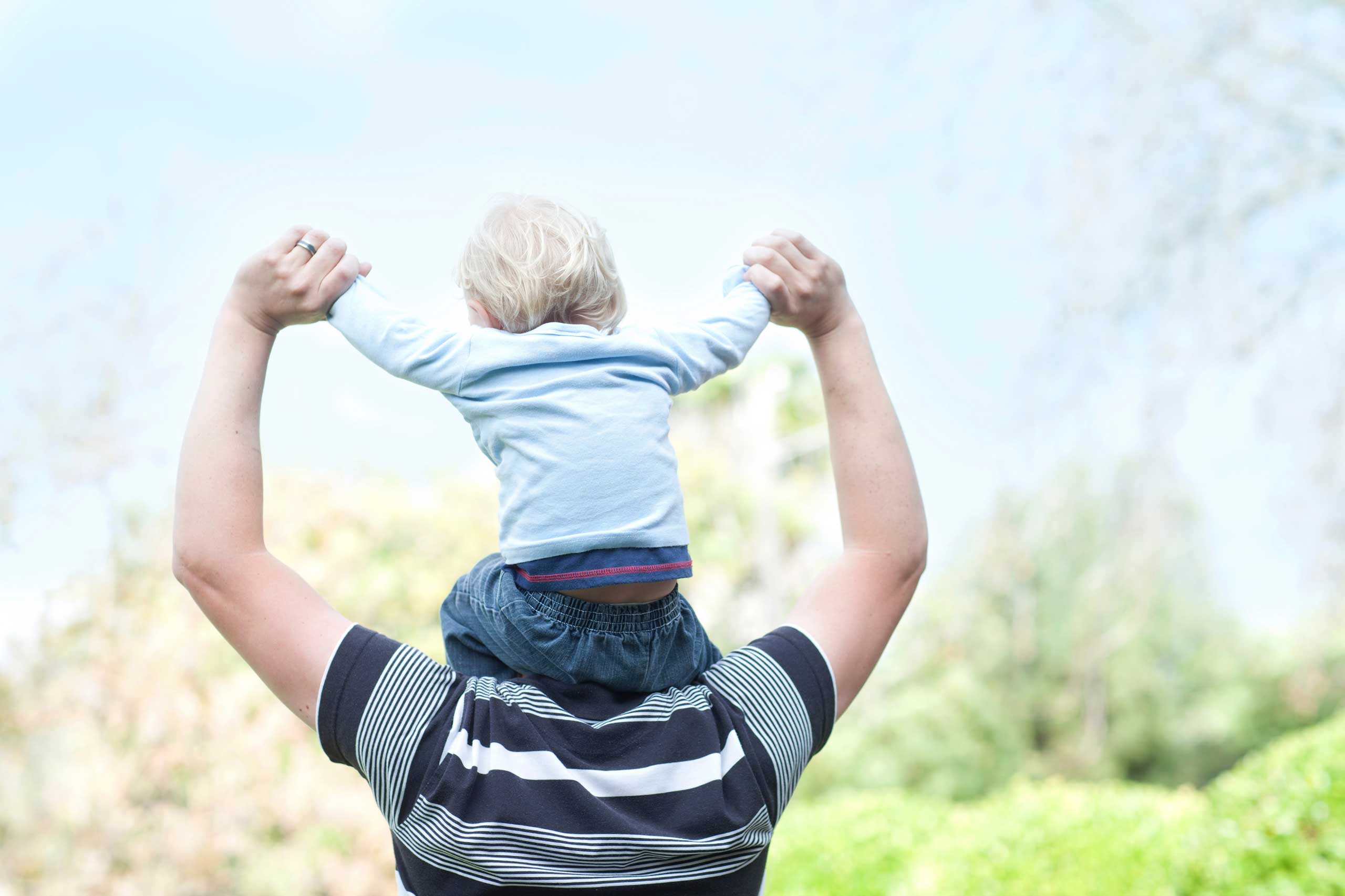 Father with baby son on shoulders