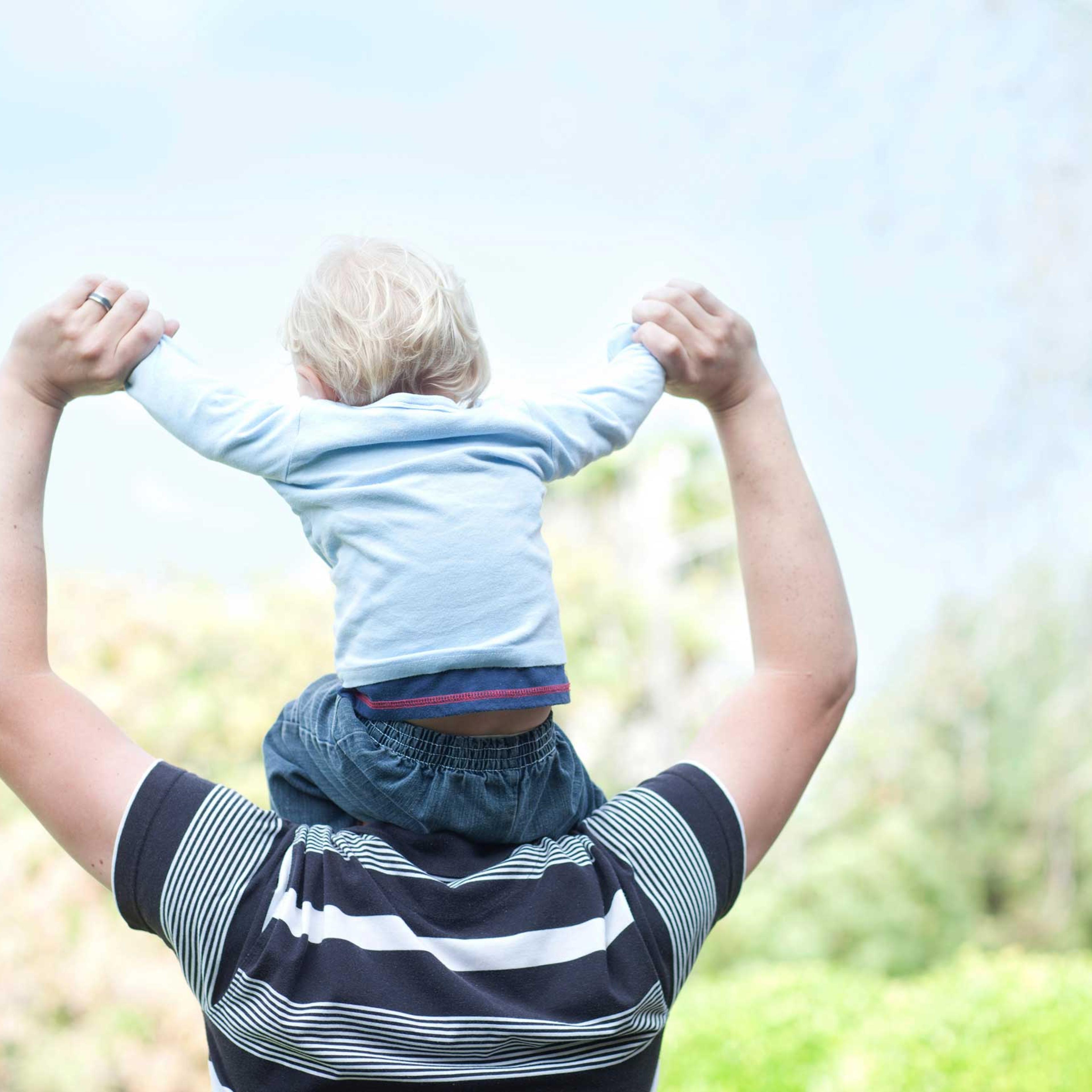 Father with baby son on shoulders