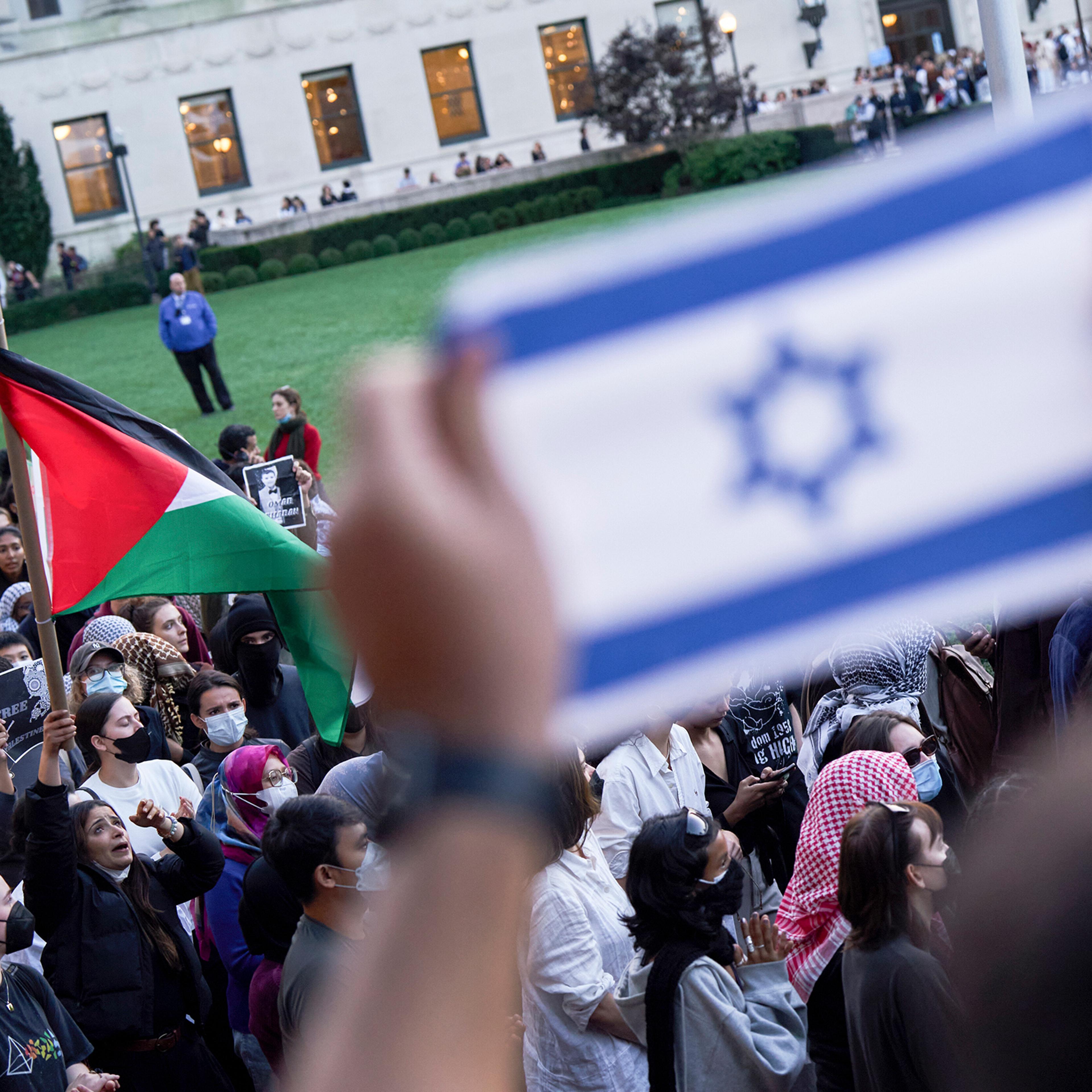 Pro-Palestinian demonstrators and counterprotestors on the Columbia University campus in New York, on Oct. 12, 2023.