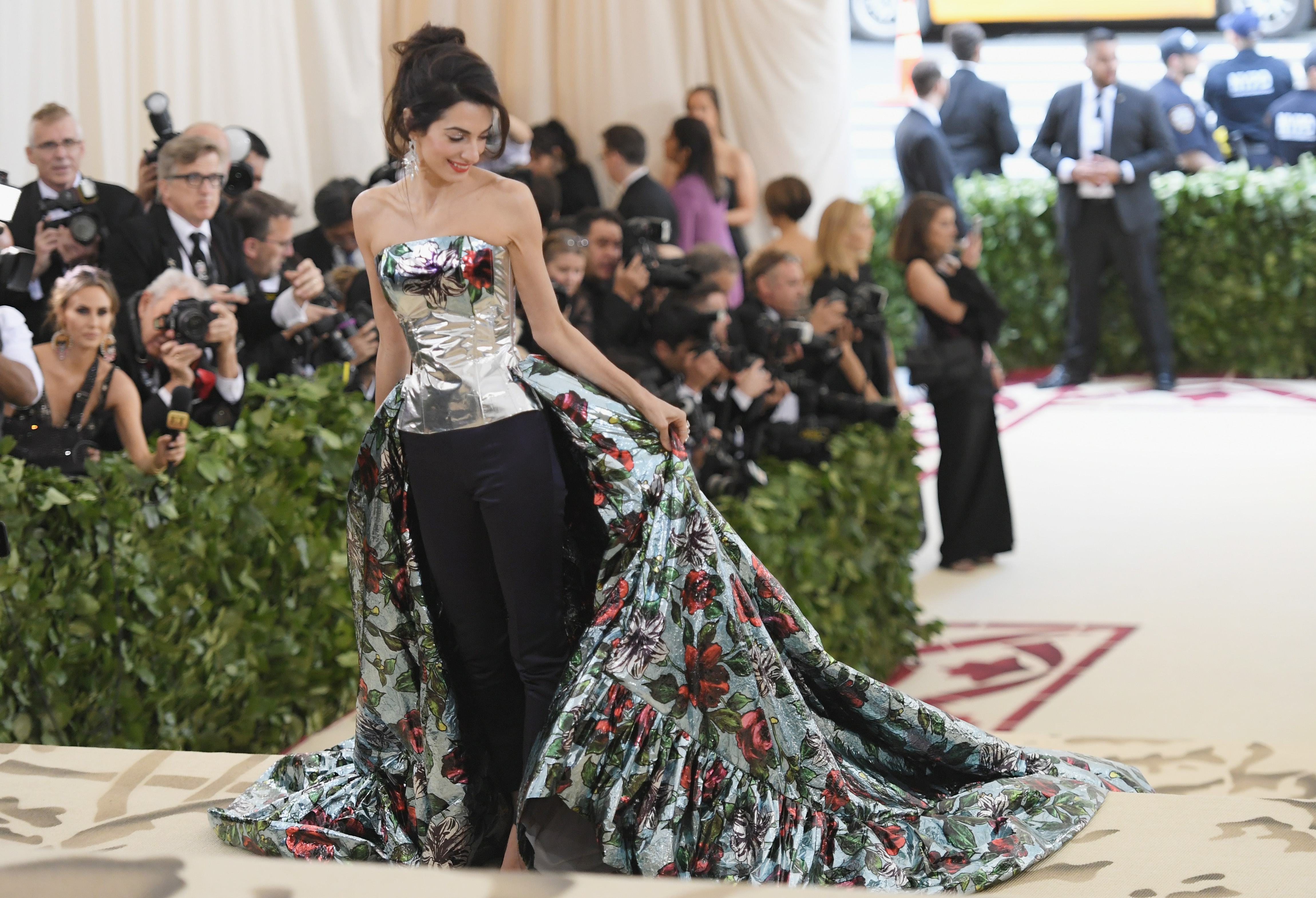 amal clooney red carpet dresses  Amal Clooney steals the spotlight in a jaw-dropping red mini dress by  Oscar de la Renta at the Jay Kelly premiere!  She elegantly reimagined her  wedding gown designer's masterpiece, proving