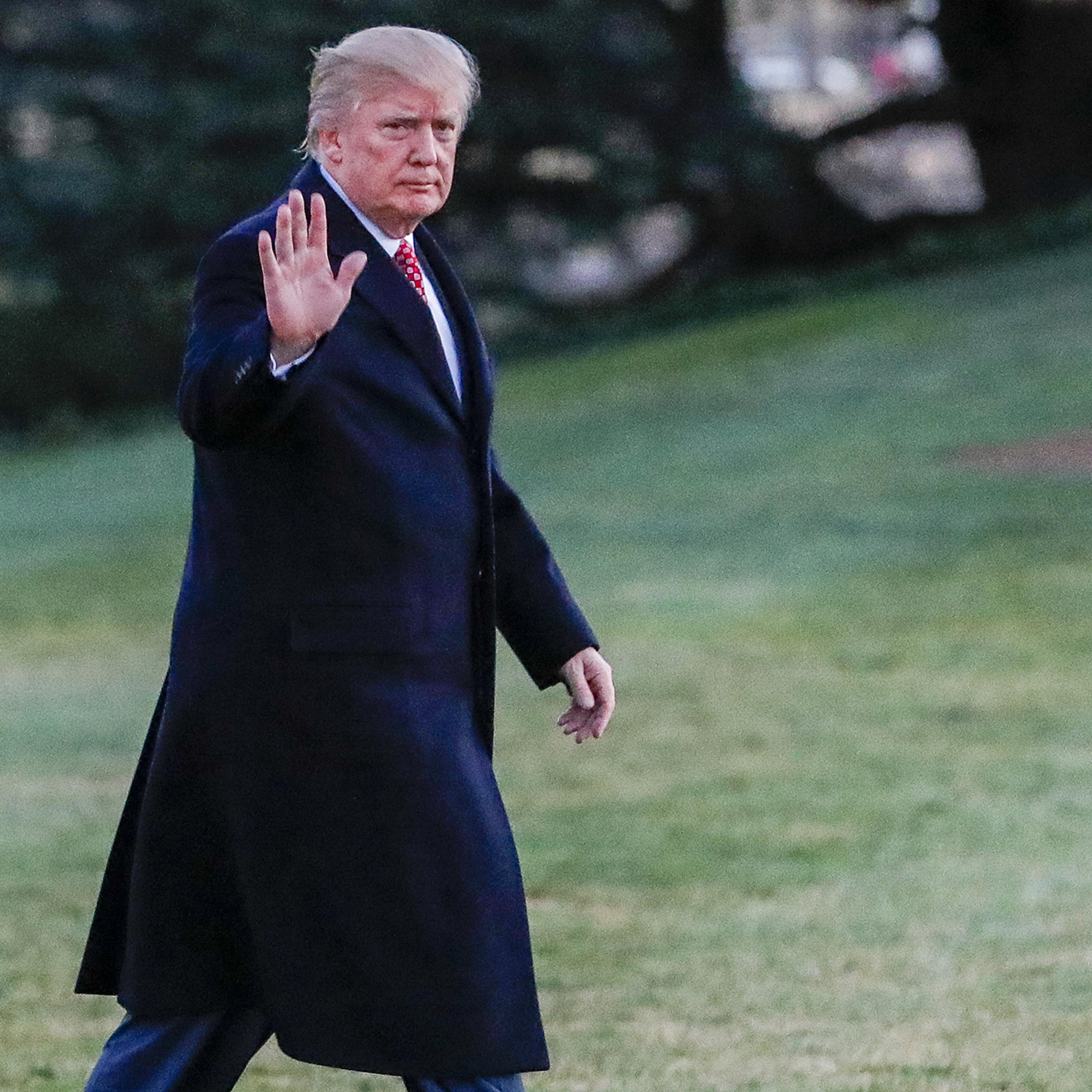 Donald Trump gestures after disembarking Marine One walking on the South Lawn towards the Oval Office of the White House in Washington, D.C., on March 5, 2017.