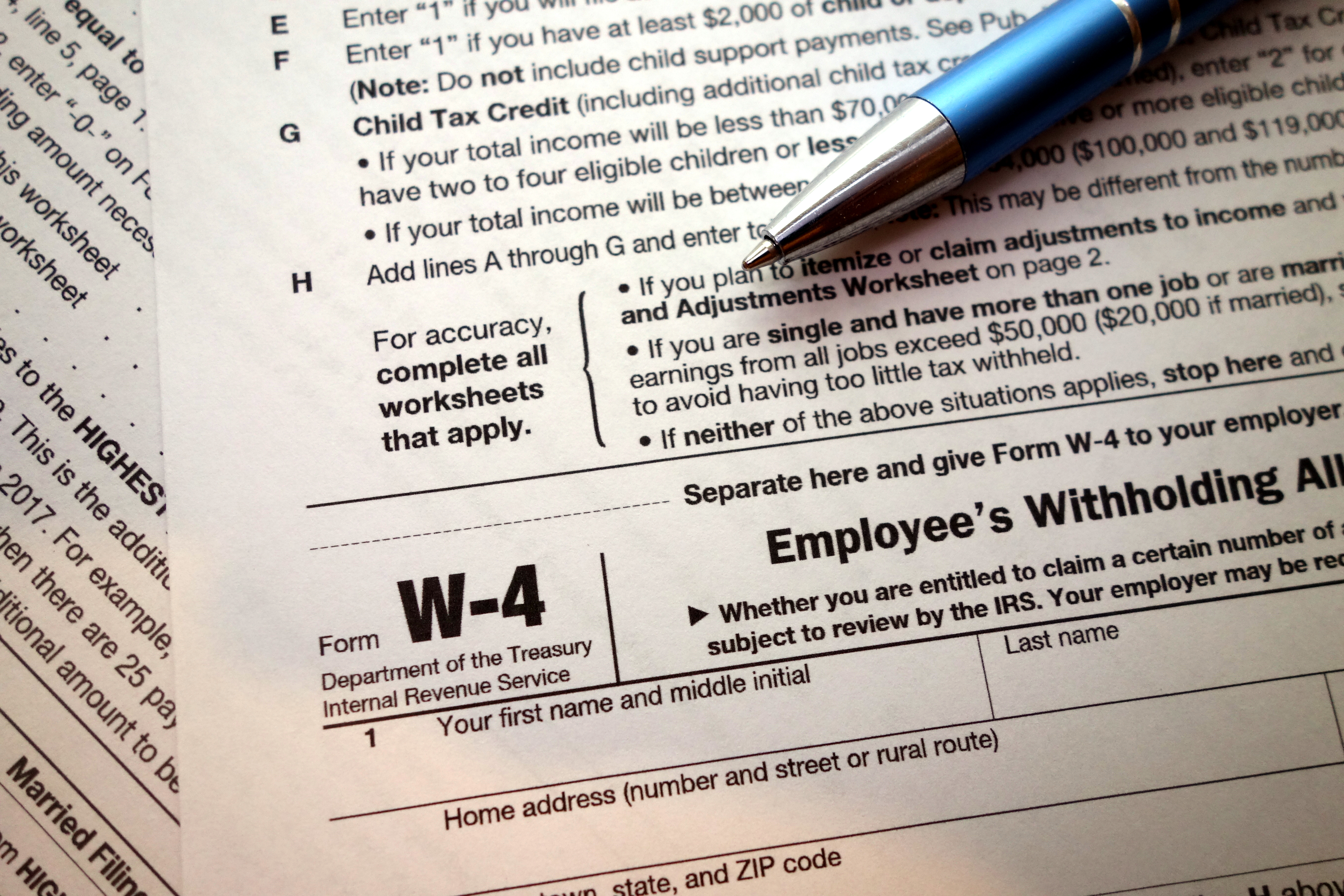W-4 form and a pen