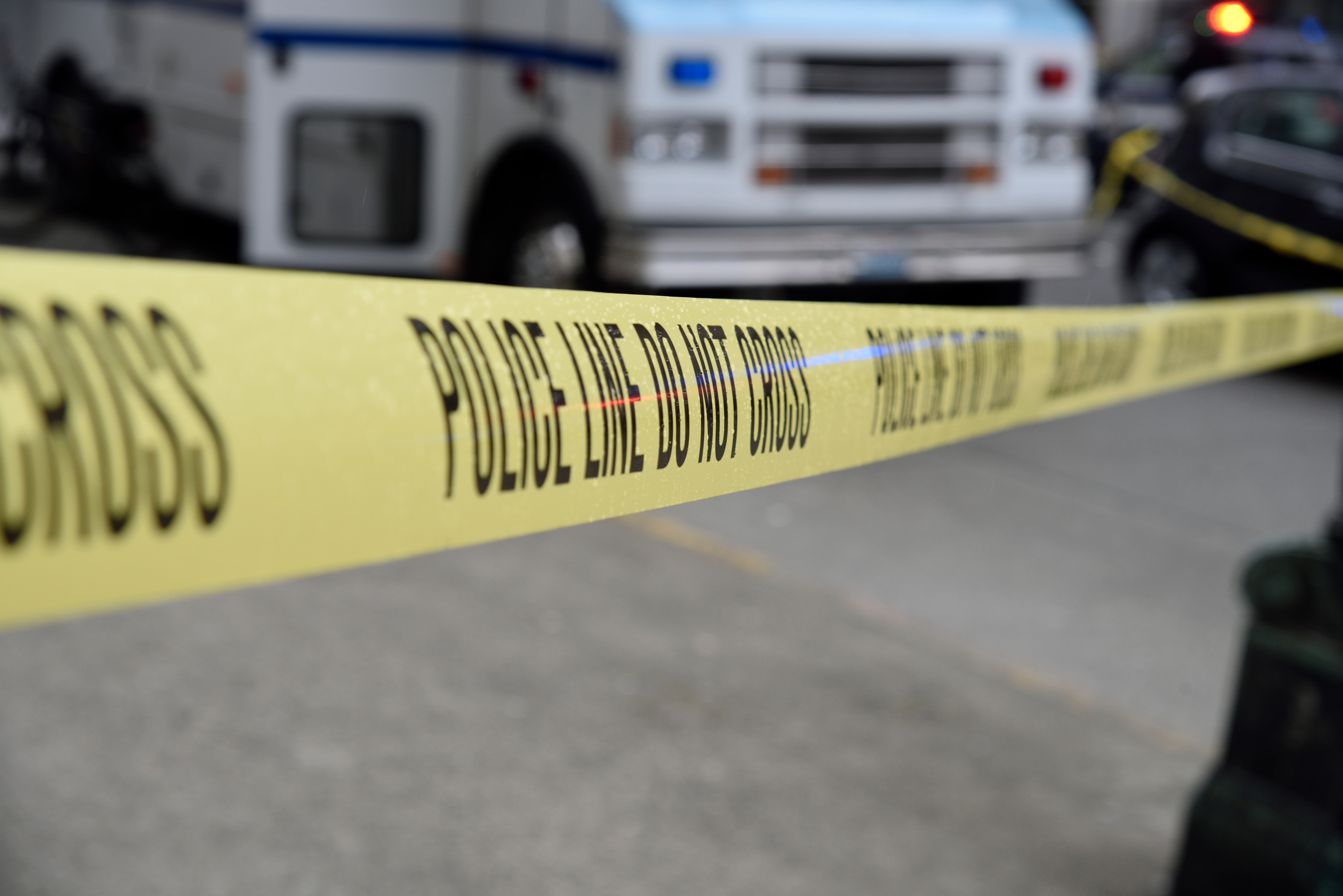 Close-Up Of Cordon Tape With Forbidden Sign