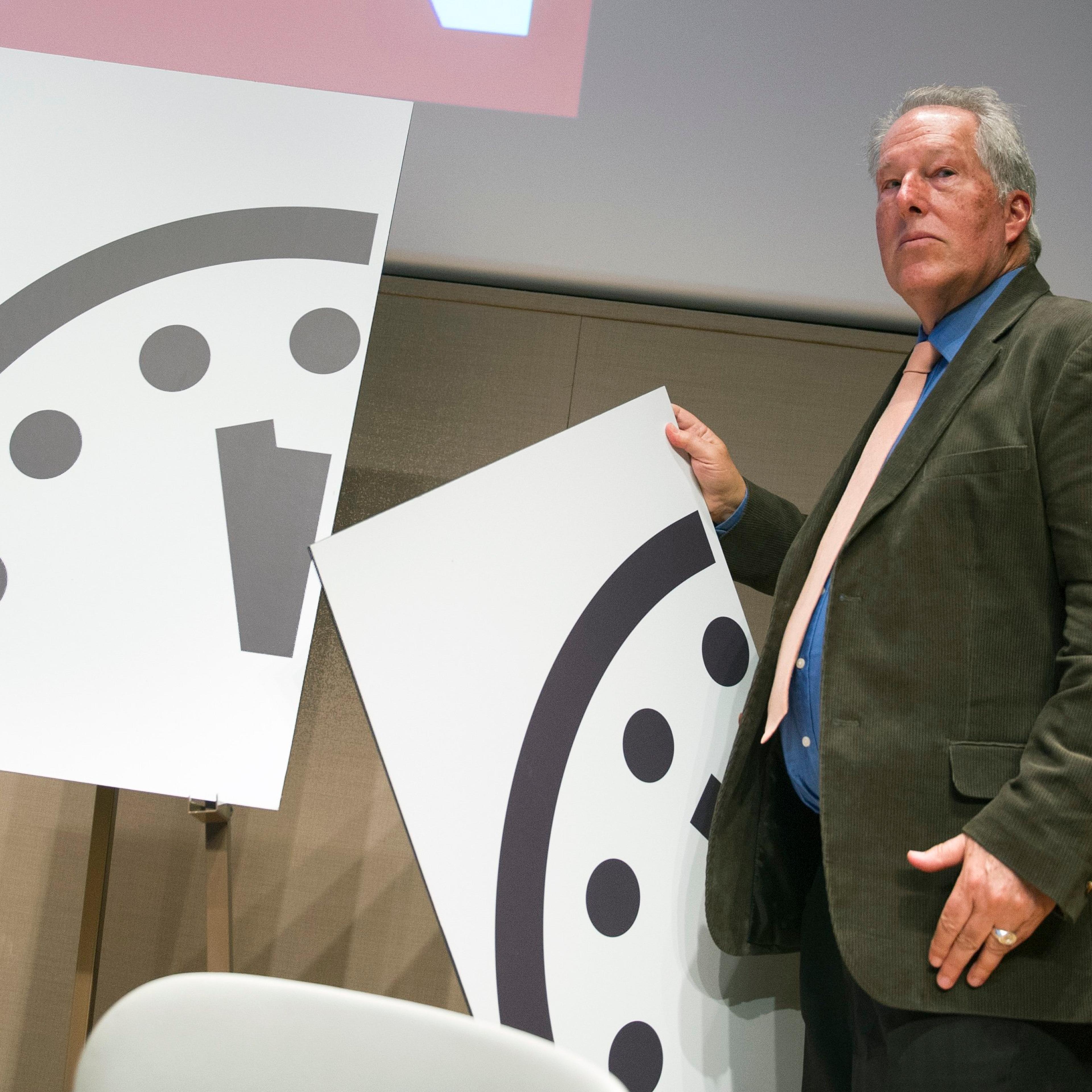 Climate scientist Richard Somerville, a member, Science and Security Board, Bulletin of the Atomic Scientists, unveils the new Doomsday Clock in Washington on Jan. 22, 2015.
