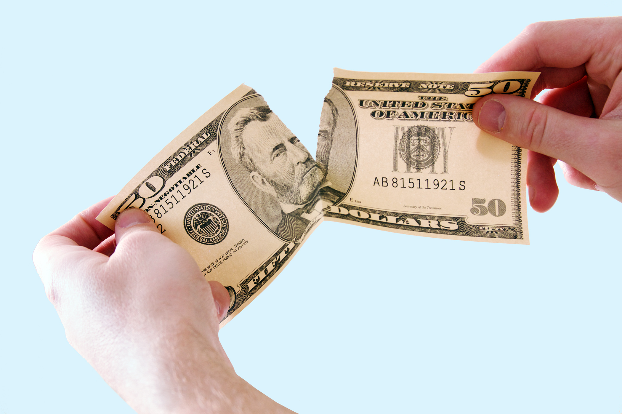 tearing money