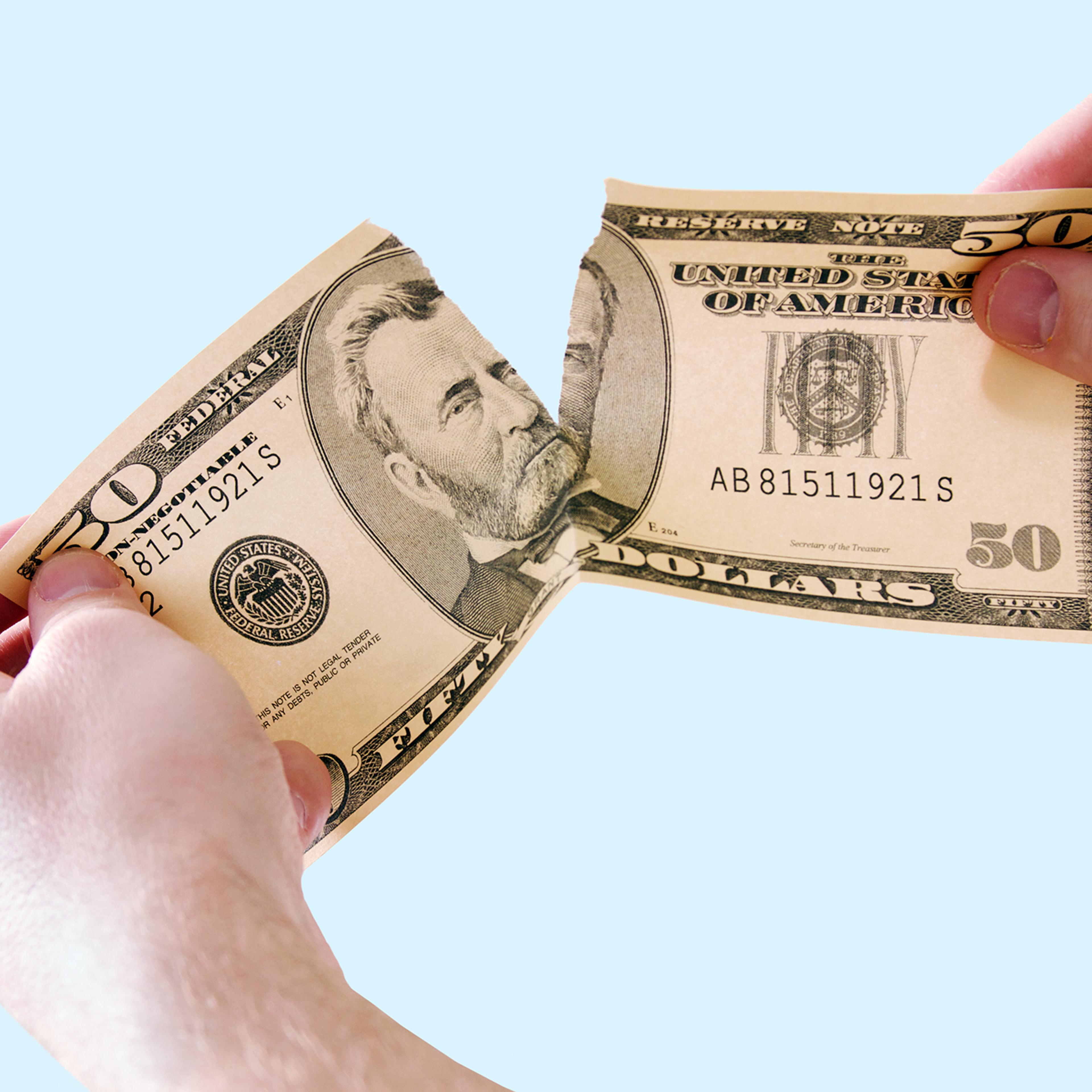 tearing money