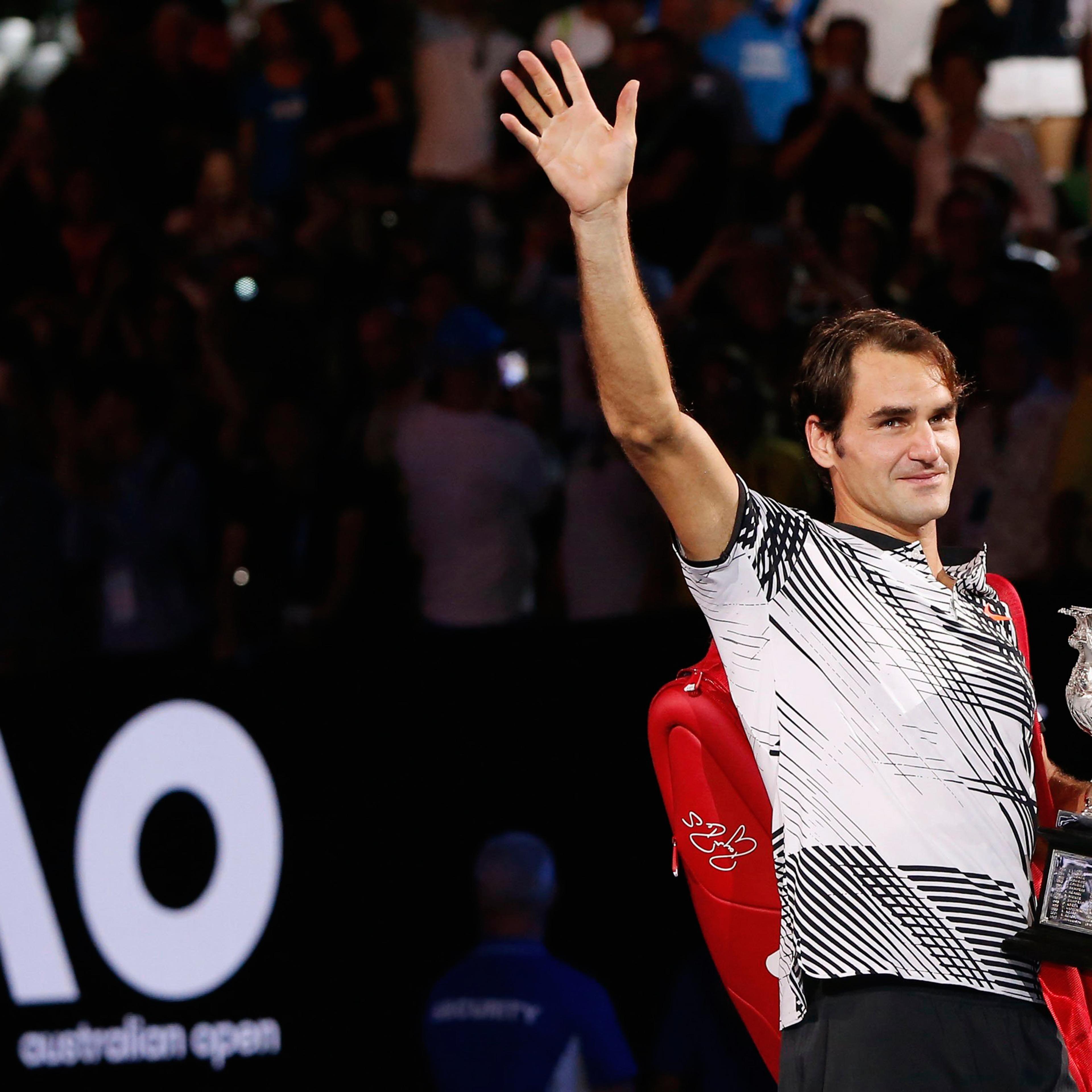 Tennis - Australian Open - Melbourne Park, Melbourne, Australia - 29/1/17 Switzerland's Roger Federer holds the trophy as he celebrates after winning his Men's singles final match against Spain's Rafael Nadal. REUTERS/Issei Kato TPX IMAGES OF THE DAY
