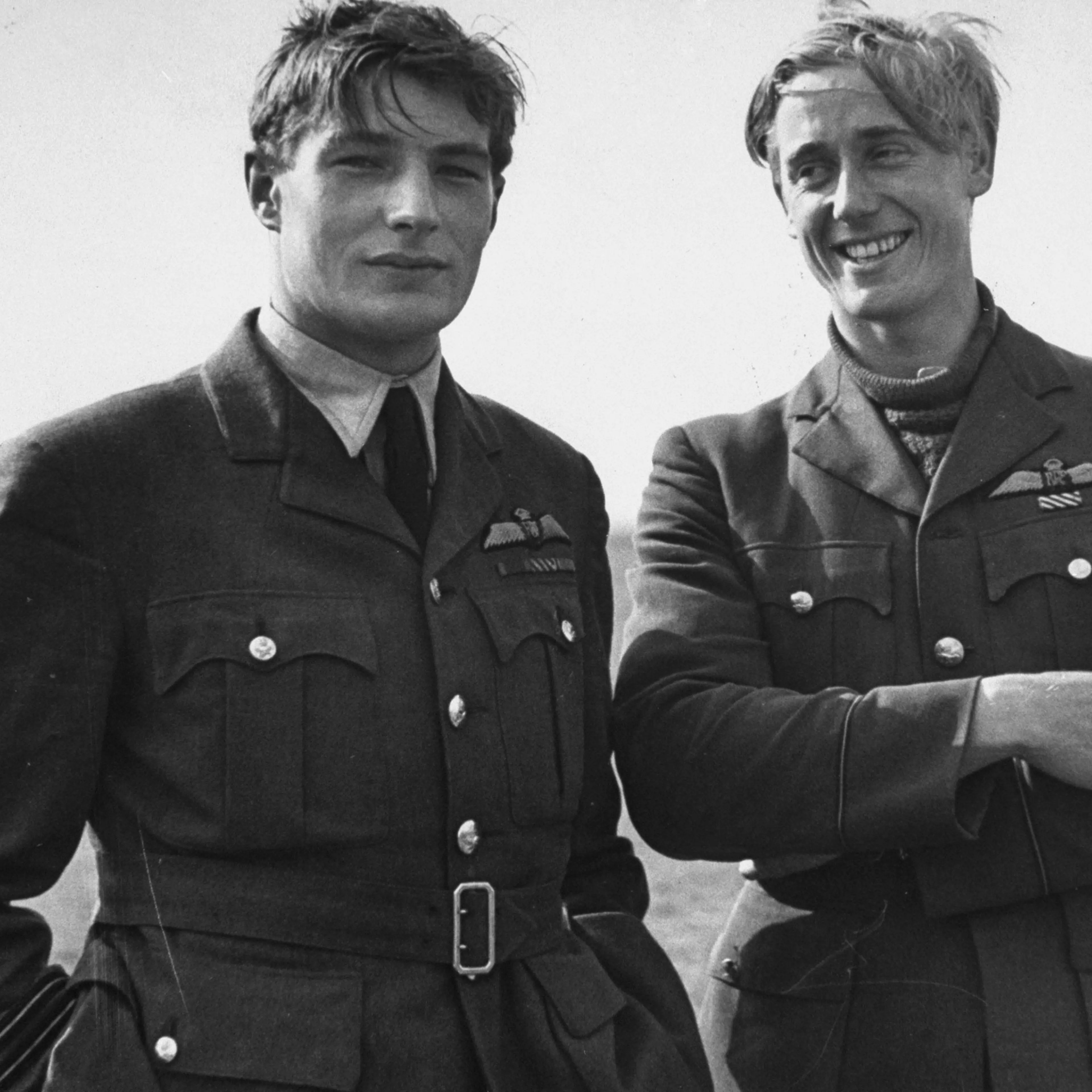 Two pilots (Flying Officer Albert Gerald Lewis on right, unidentified flyer at left) between flights during the Battle of Britain, RAF Fighter Command airfield, 1940.