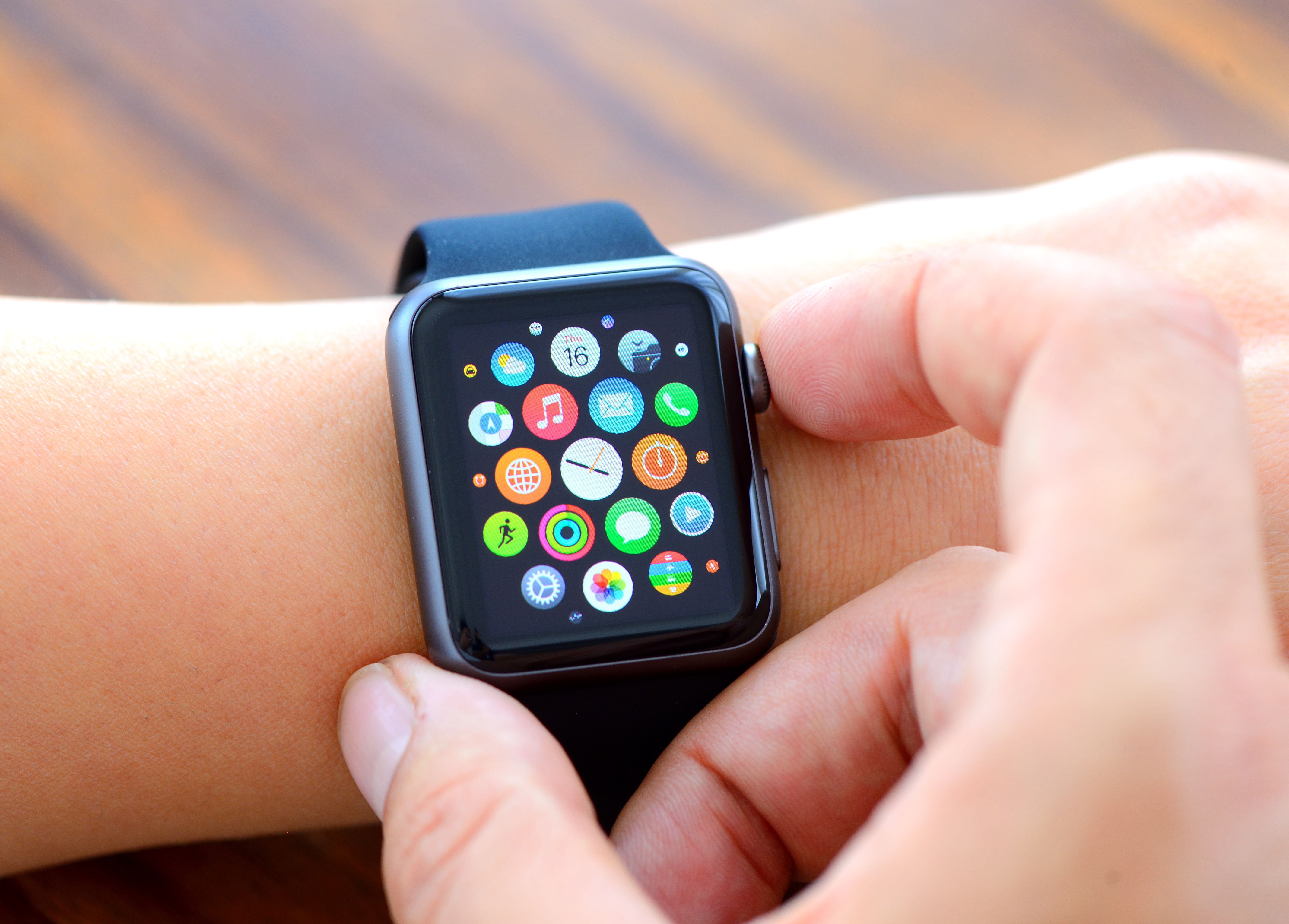 Woman hands and Black Apple Watch Sport