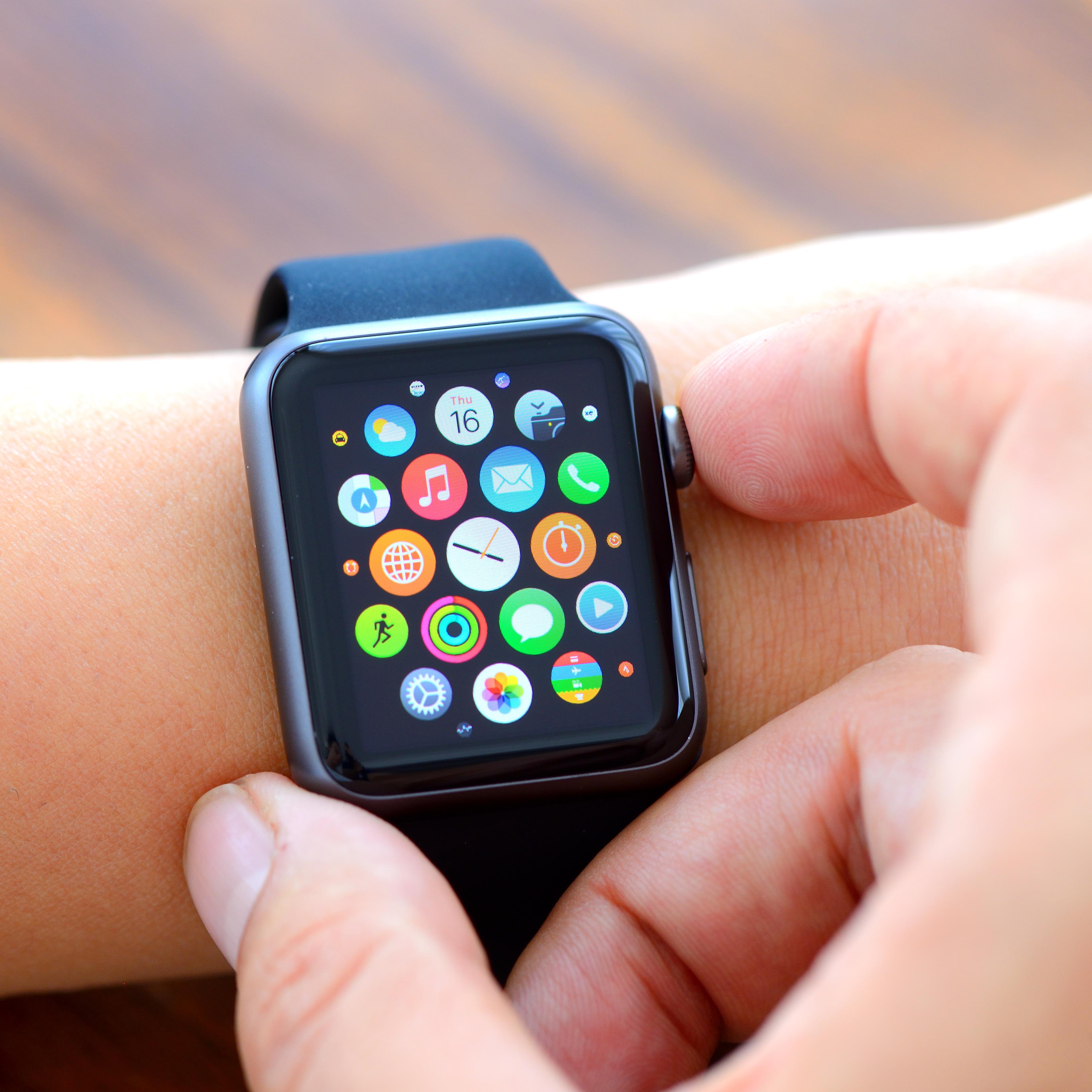 Woman hands and Black Apple Watch Sport