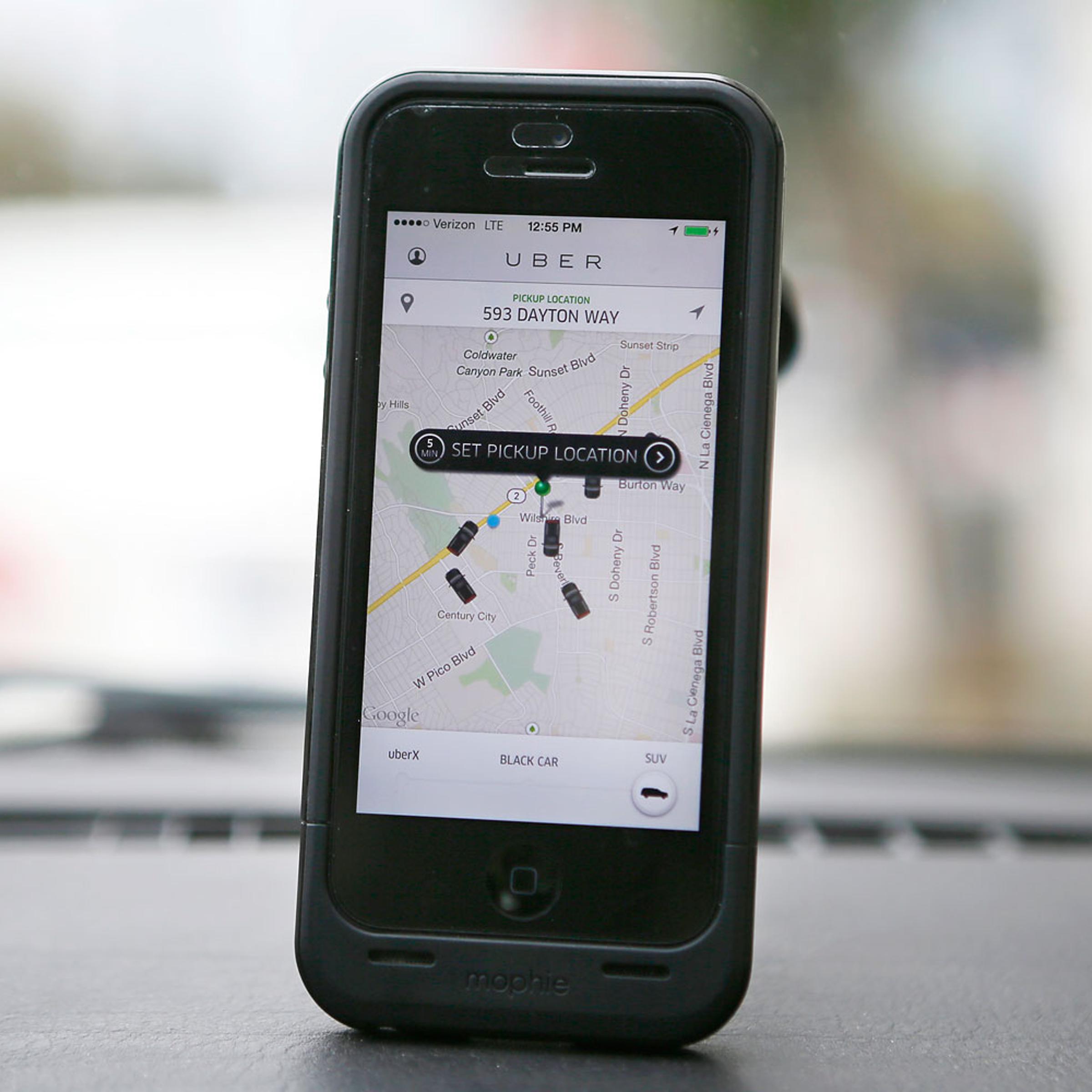 An Uber app is seen on an iPhone in Beverly Hills, Calif., on Dec. 19, 2013.