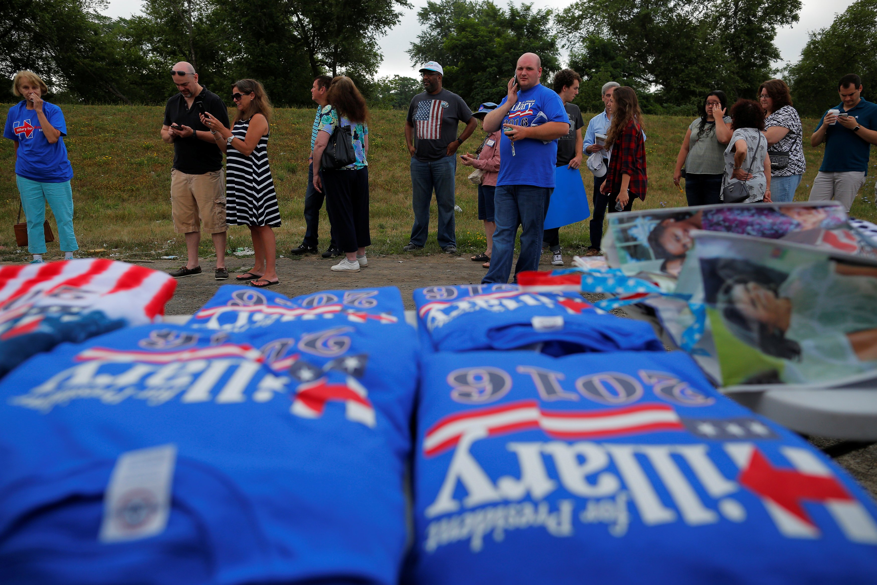 Guests wait in line before a campaign event with U.S. Democratic presidential candidate Hillary Clinton and U.S. Vice President Joe Biden in Scranton, Penns. on July 8, 2016, which was postponed "due to the tragic events in Dallas," according to the camp