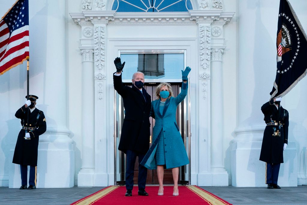 U.S. President Joe Biden and First Lady Jill Biden wave as they arrive at the White House in Washington, D.C., on January 20, 2021.