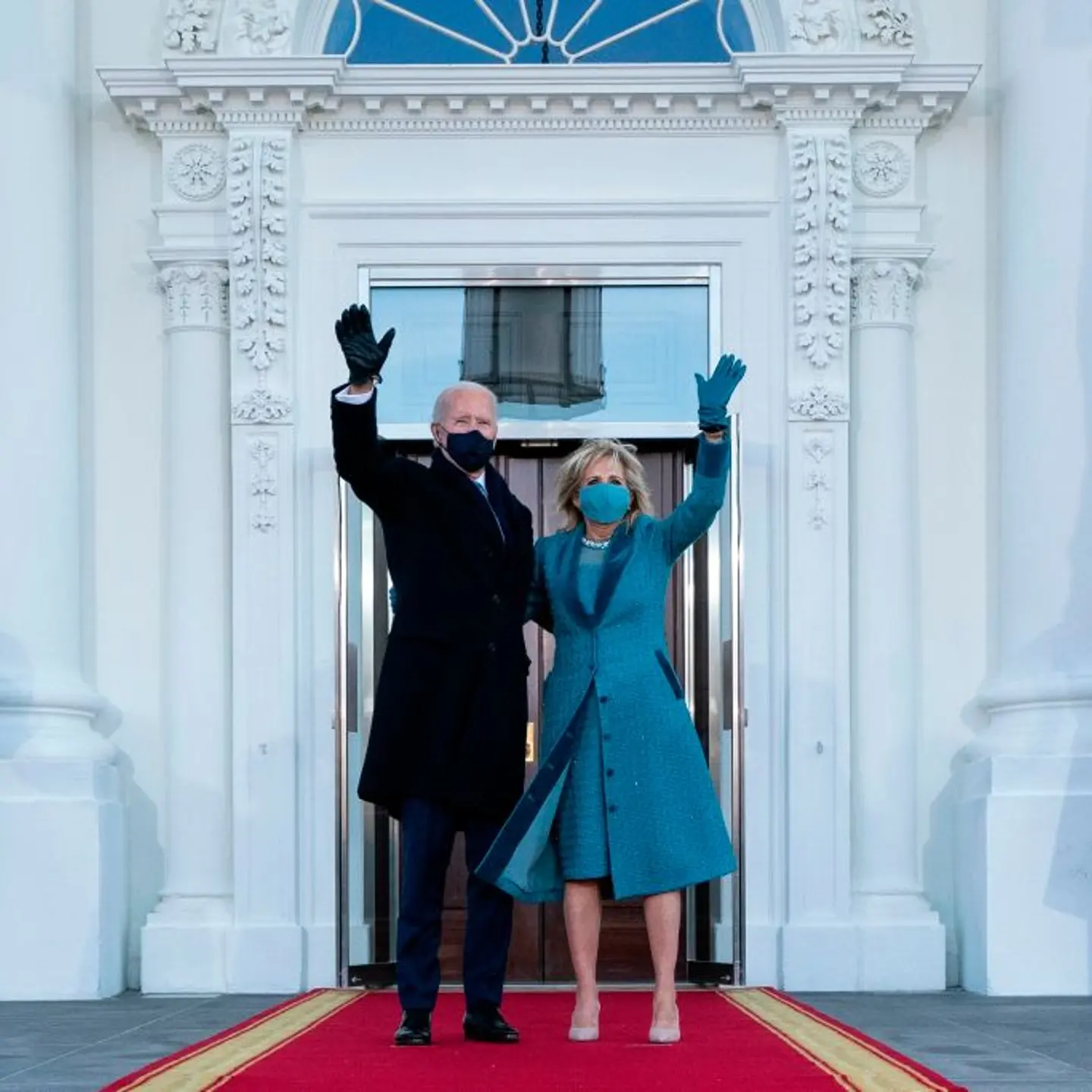 U.S. President Joe Biden and First Lady Jill Biden wave as they arrive at the White House in Washington, D.C., on January 20, 2021.