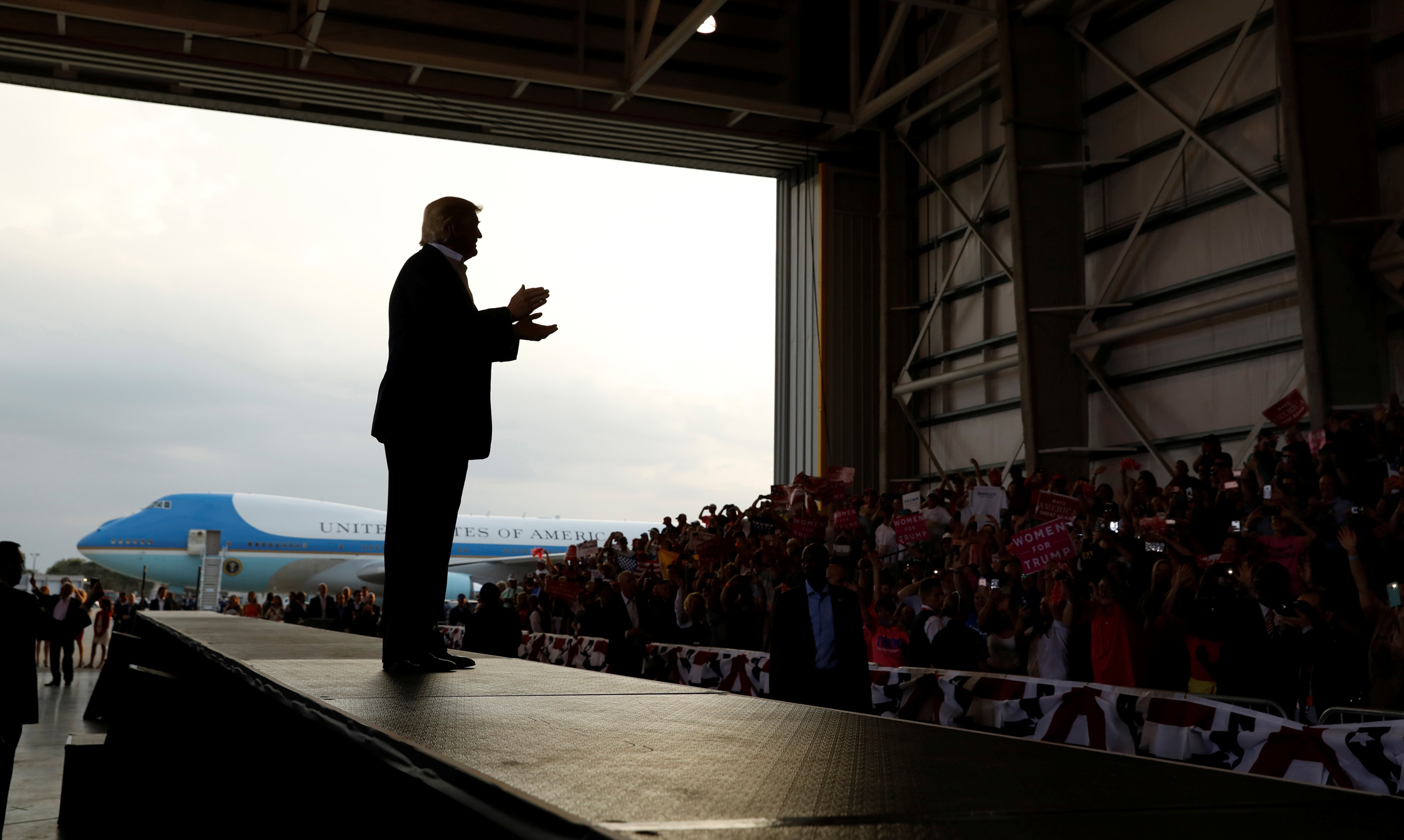 U.S. President Donald Trump applauds his crowd as he holds a "Make America Great Again" rally at Orlando Melbourne International Airport in Melbourne, Florida, U.S. February 18, 2017. REUTERS/Kevin Lamarque TPX IMAGES OF THE DAY - RTSZBI2