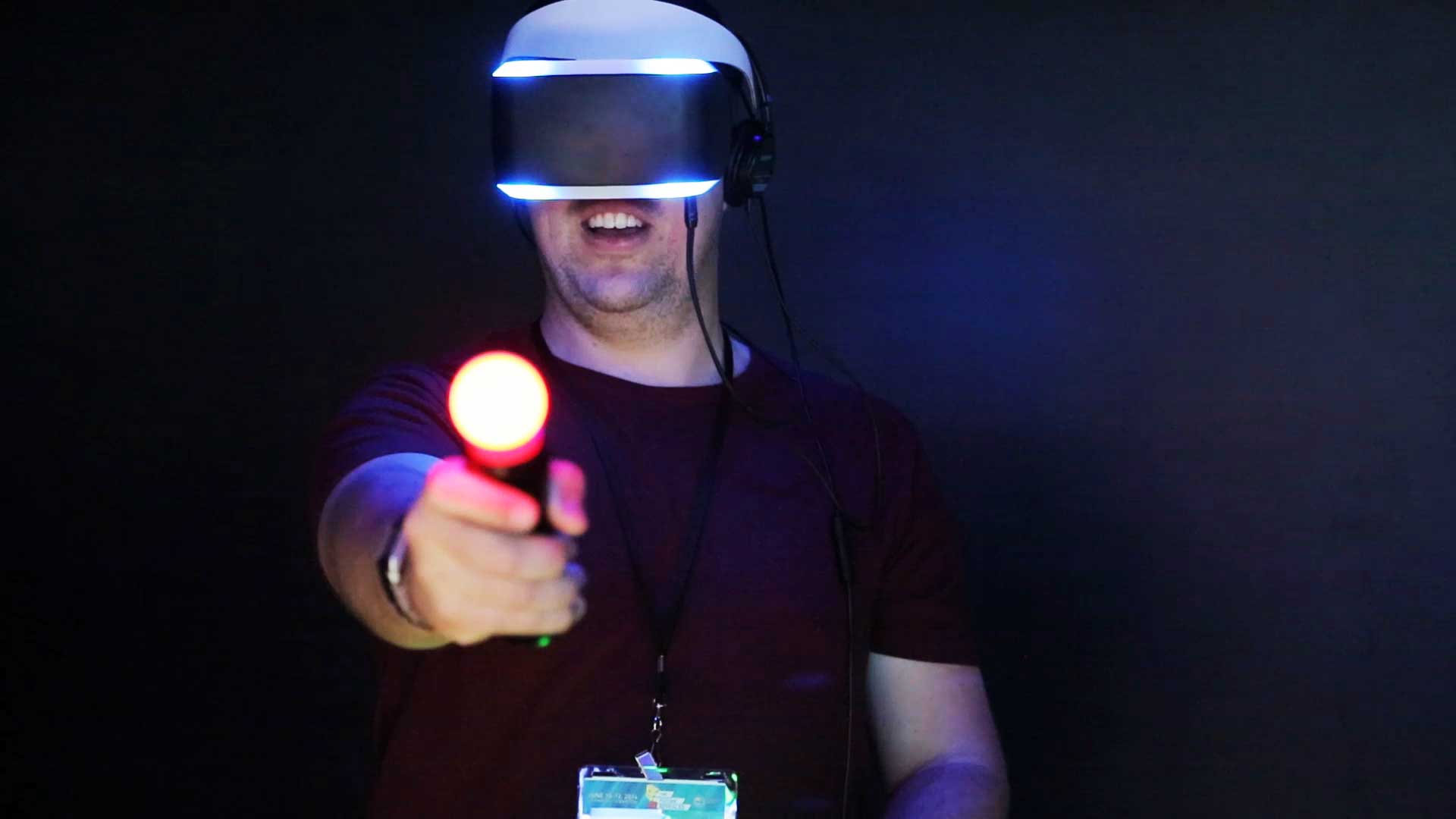 GDC 2014 attendee, demoing Sony's virtual reality headset: Project Morpheus. 