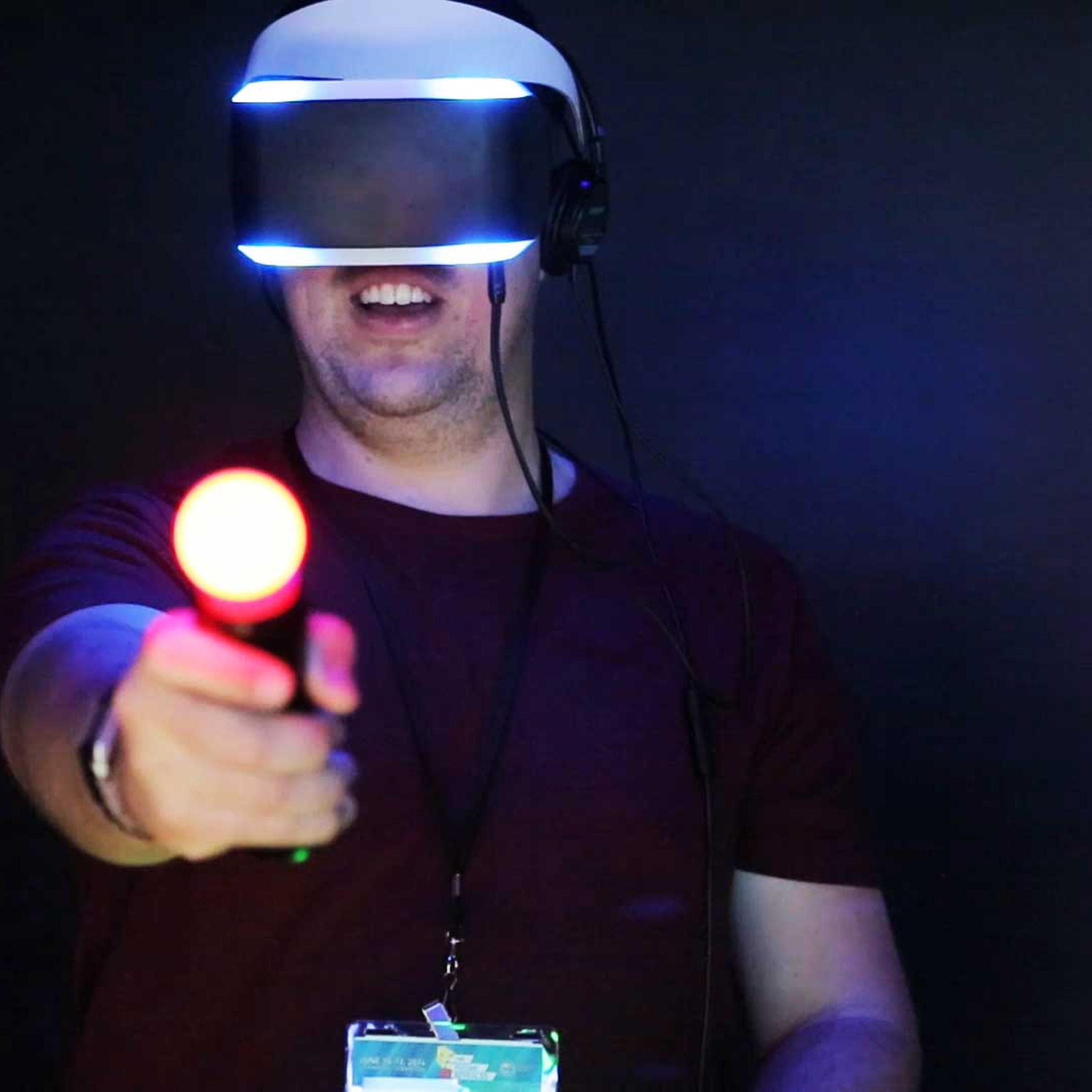 GDC 2014 attendee, demoing Sony's virtual reality headset: Project Morpheus.