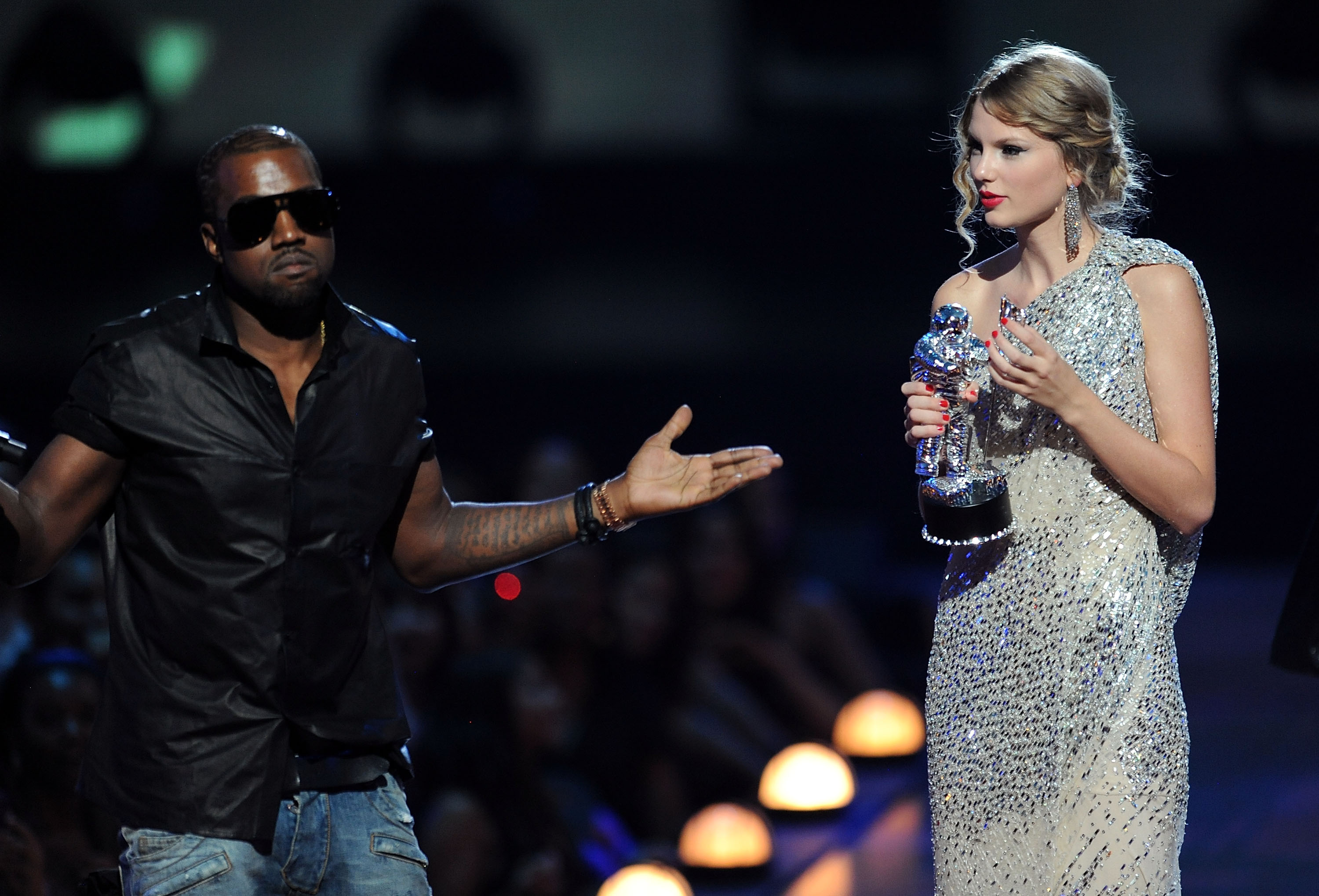 Kanye West takes the microphone from Taylor Swift and speaks onstage during the 2009 MTV Video Music Awards at Radio City Music Hall on September 13, 2009 in New York City.