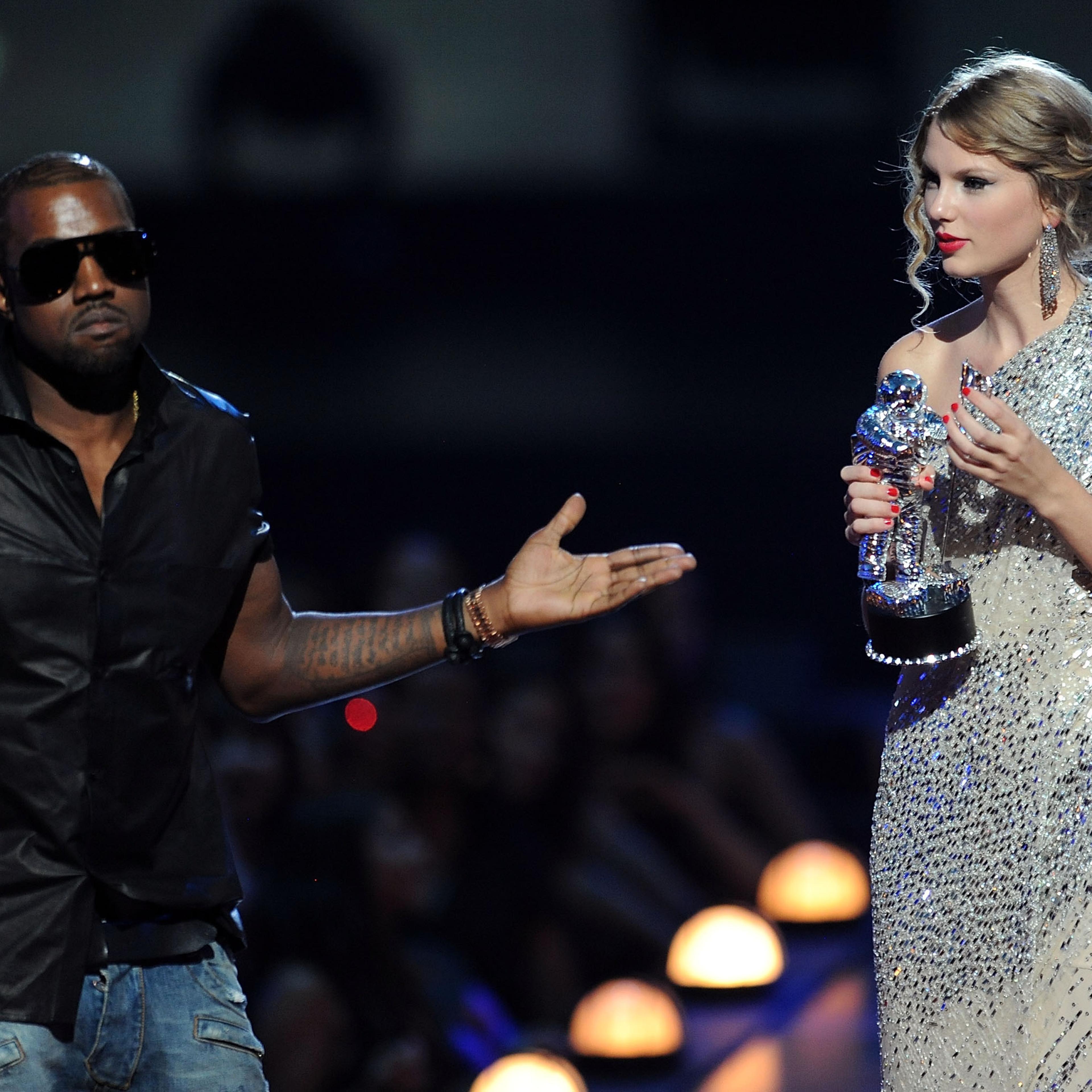 Kanye West takes the microphone from Taylor Swift and speaks onstage during the 2009 MTV Video Music Awards at Radio City Music Hall on September 13, 2009 in New York City.