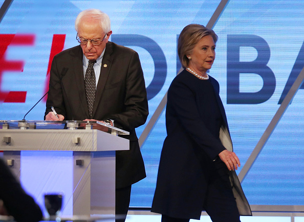 Democratic presidential candidate Senator Bernie Sanders (D-VT) and Democratic presidential candidate Hillary Clinton are seen on stage during a break in the broadcast of the Univision News and Washington Post Democratic Presidential Primary Debate at th