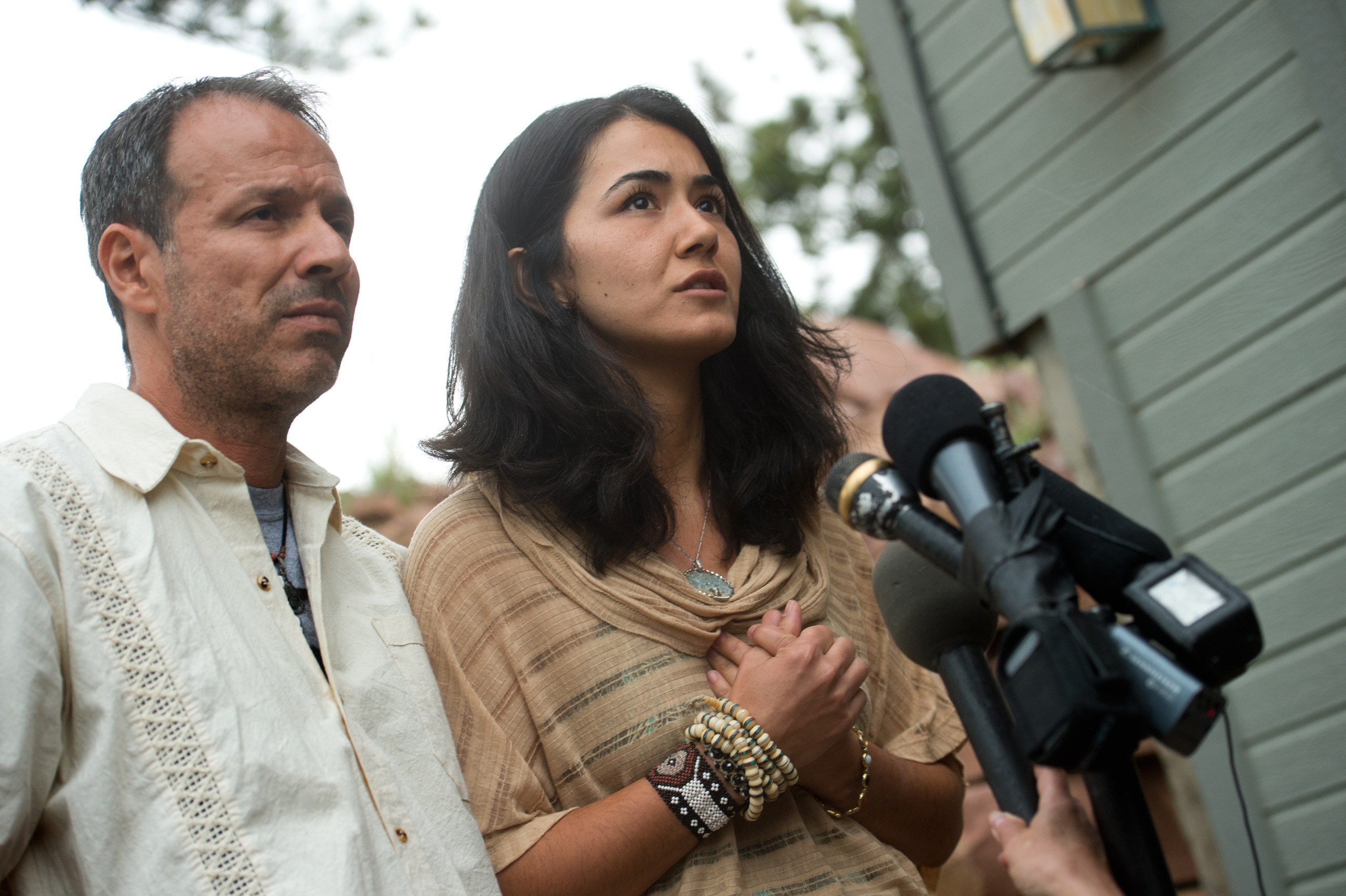 Sitora Yusufiy, the ex-wife of Orlando shooting suspect Omar Mateen, and her fiance Marcio Dias, give a statement to the media at their home outside Boulder, Colo. on June 12, 2016.