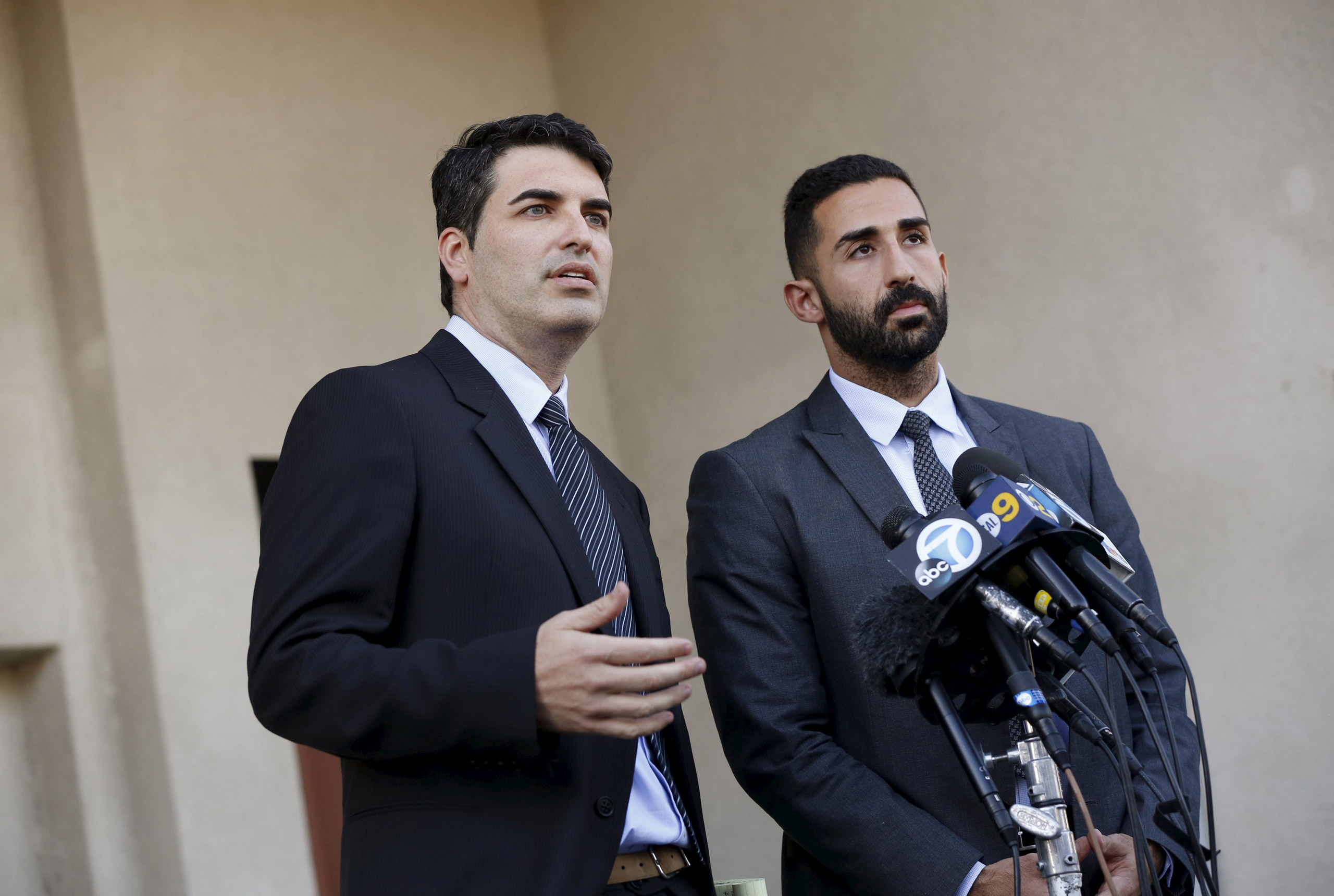 Lawyers representing the Farook family, David S. Chesley and Mohammad Abuershaid (R), speak during a news conference in Los Angeles, California December 4, 2015. The FBI is investigating this week's massacre of 14 people by a married couple in California