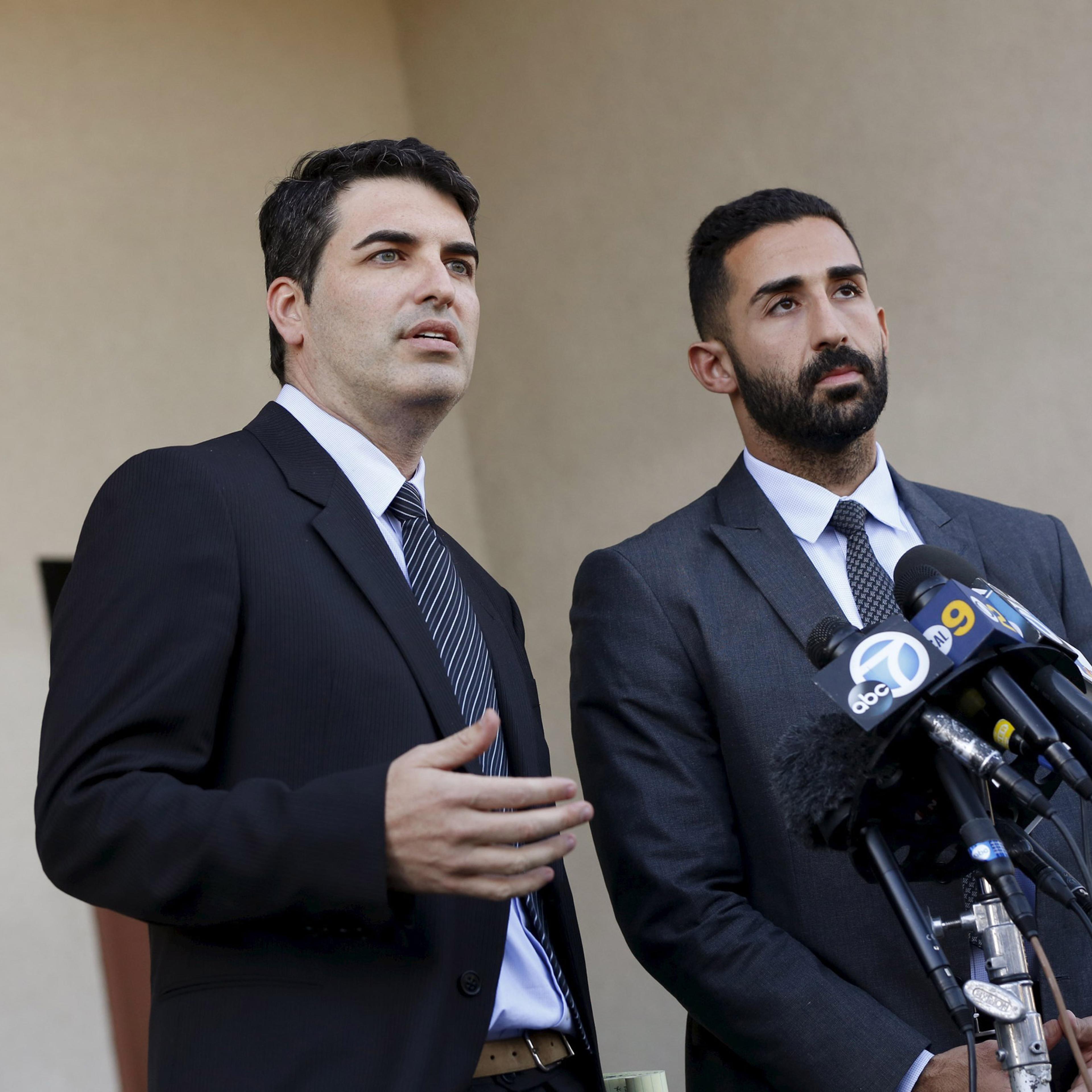 Lawyers representing the Farook family, David S. Chesley and Mohammad Abuershaid (R), speak during a news conference in Los Angeles, California December 4, 2015. The FBI is investigating this week's massacre of 14 people by a married couple in California