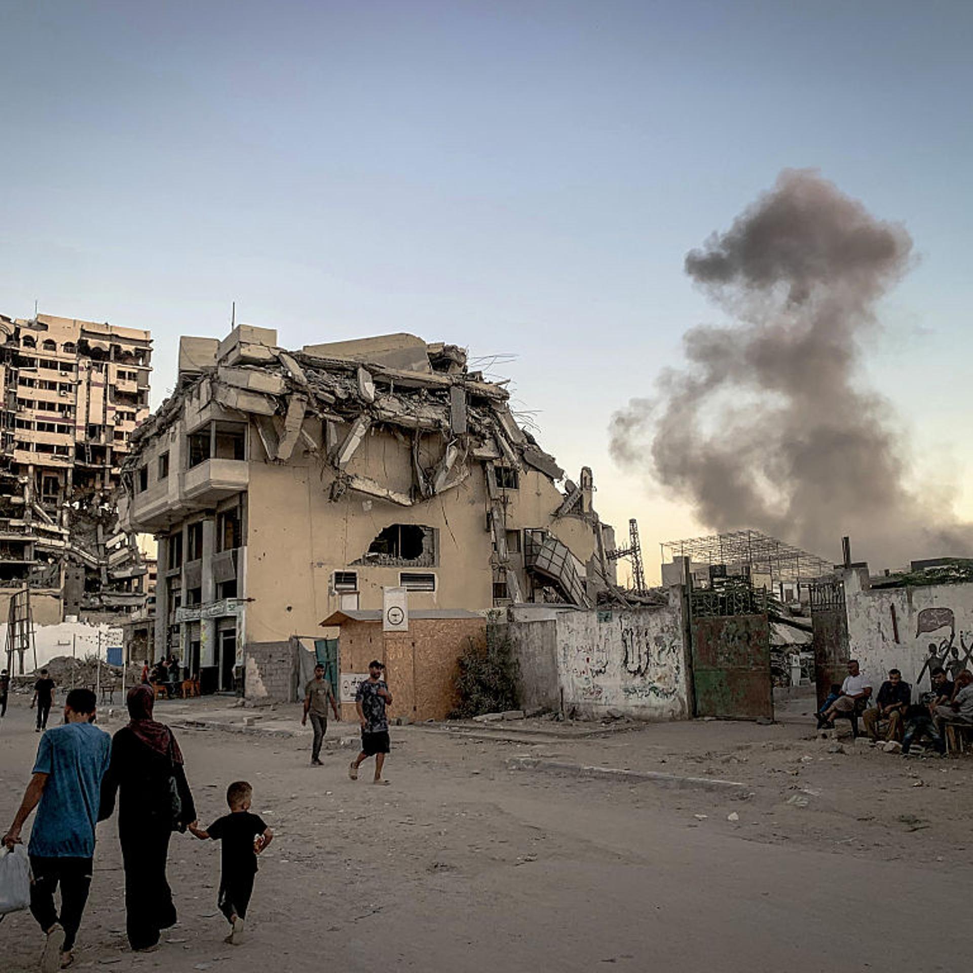 Thick plumes of smoke rise after an Israeli airstrike hit Gaza City on Oct. 7, 2025.