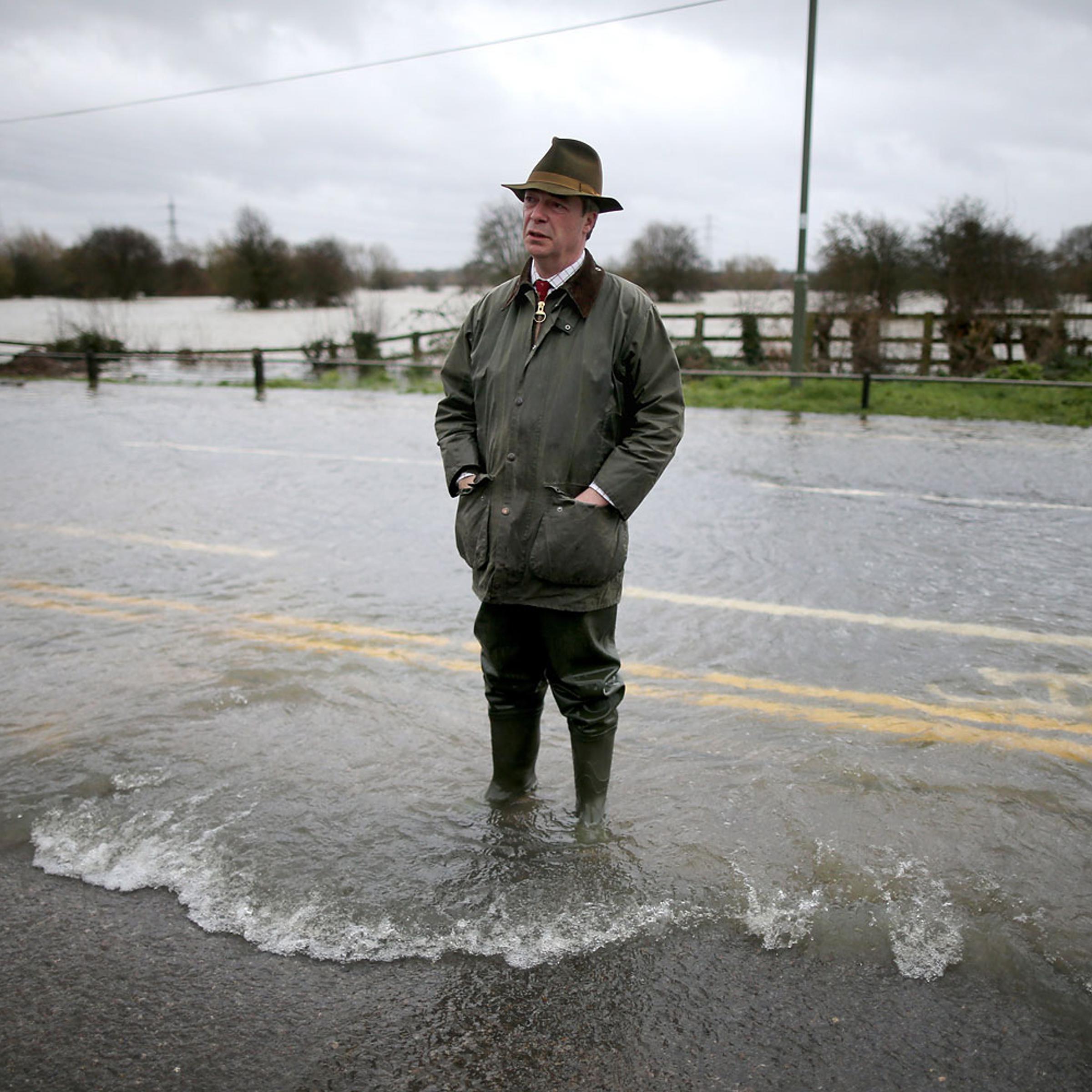 Leader of UKIP Nigel Farage tours flooded properties and roads as he visits Chertsey on Feb. 11, 2014 in Chertsey, United Kingdom.
