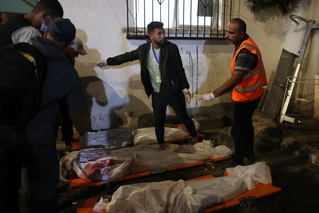 Medics prepare the bodies of Gazans killed in an Israeli strike on a camp for internally displaced Palestinians at a hospital in Rafah on May 26, 2024, amid the ongoing conflict between Israel and the militant group Hamas.