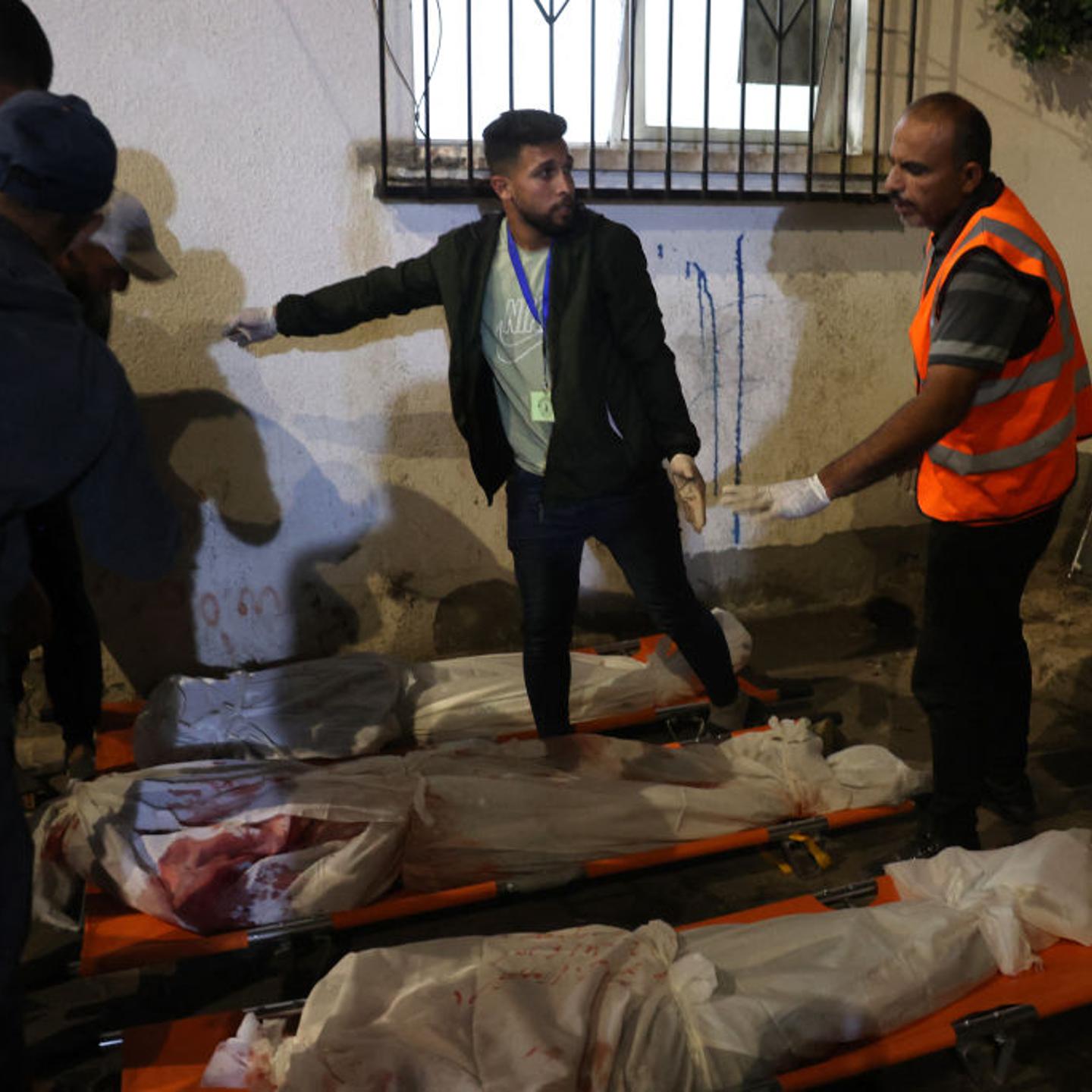 Medics prepare the bodies of Gazans killed in an Israeli strike on a camp for internally displaced Palestinians at a hospital in Rafah on May 26, 2024, amid the ongoing conflict between Israel and the militant group Hamas.