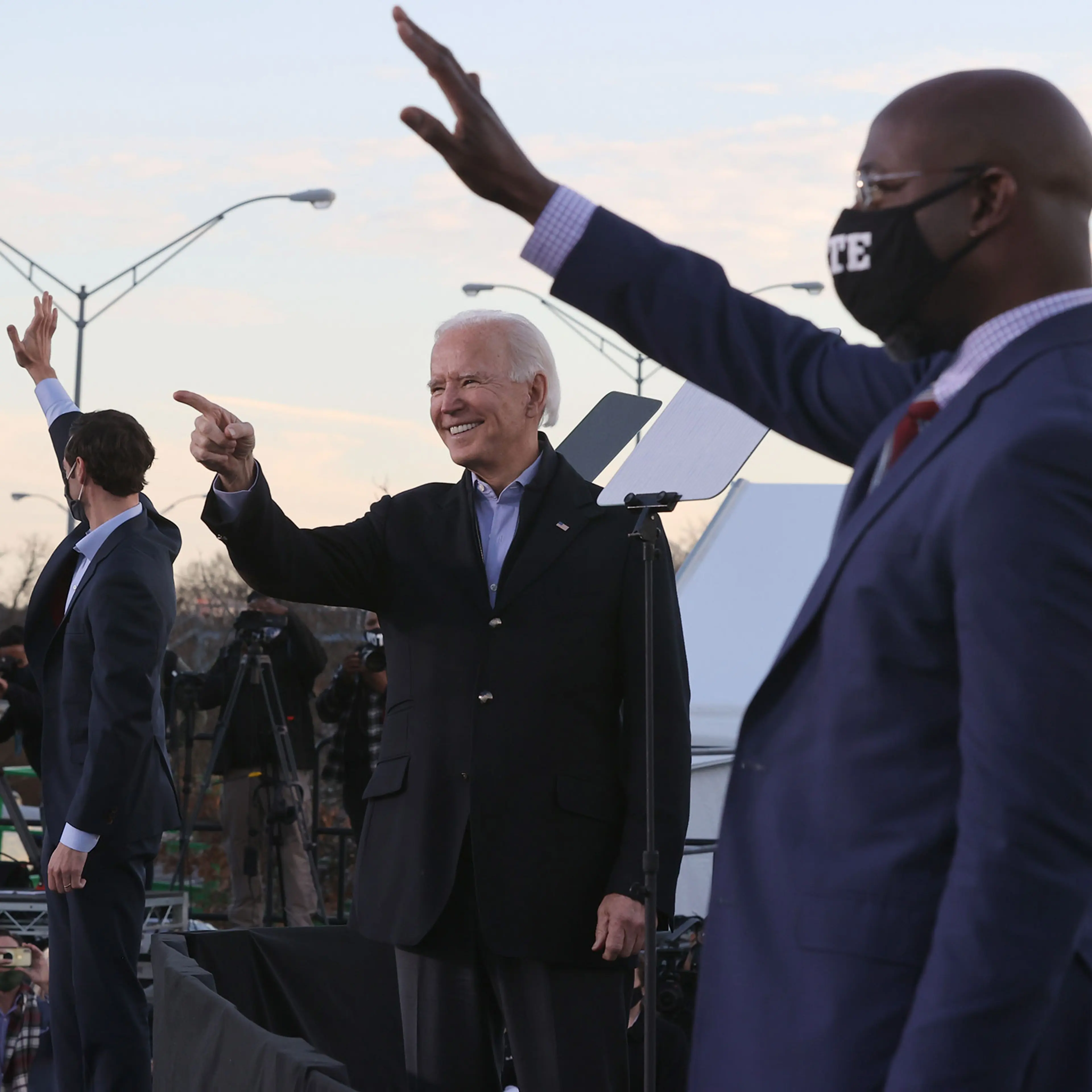 President-elect Joe Biden along with democratic candidates for the Senate Jon Ossoff and Rev. Raphael Warnock greet supporters during a campaign rally the day before their runoff election in Atlanta, on Jan. 04, 2021.