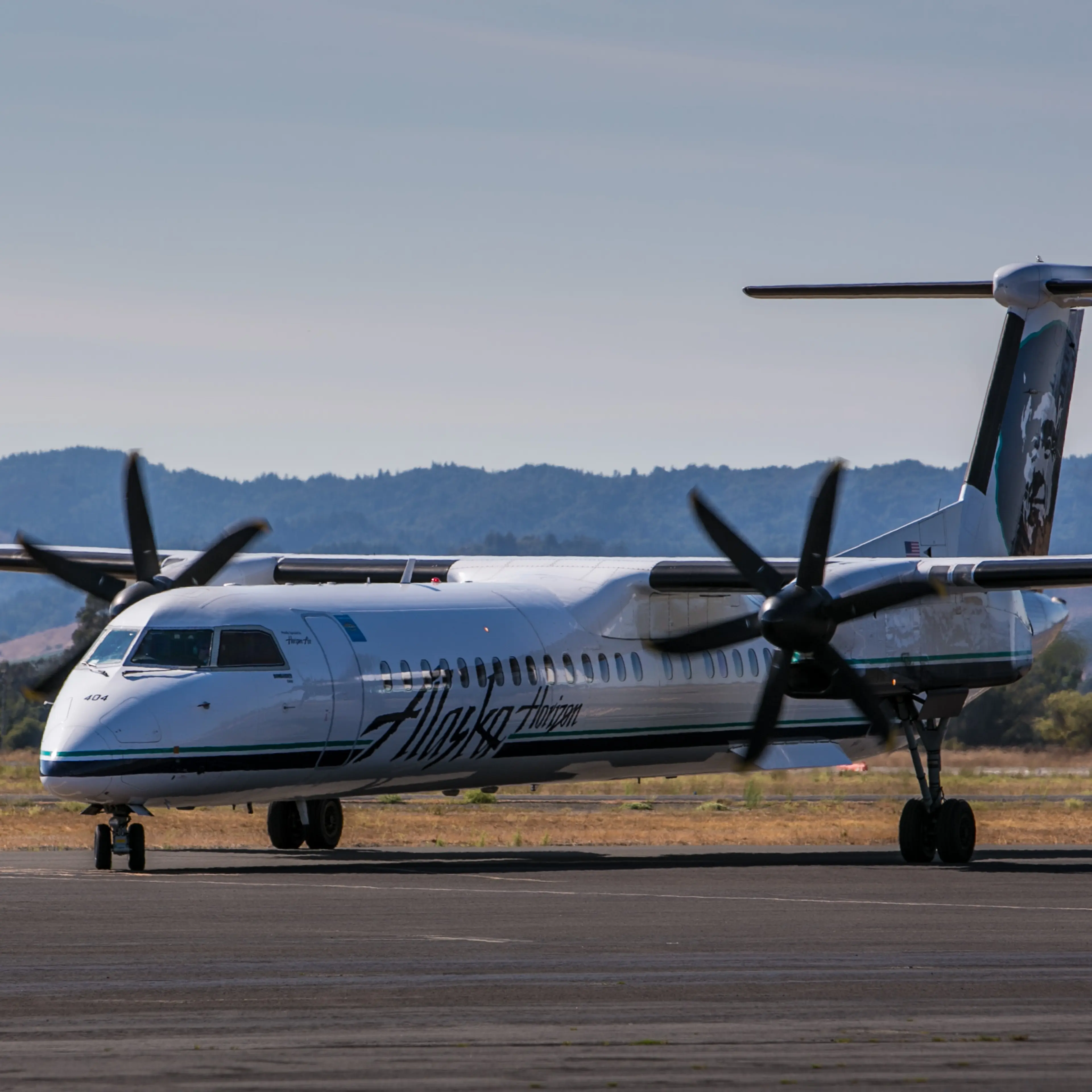 An Alaska Airlines Bombardier Q-400 regional turbo prop plane pulls into the gate at Charles M. Schulz Airport on August 27, 2014, near Healdsburg, California.