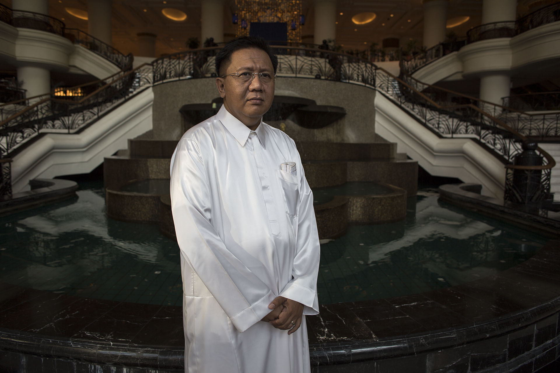 Zulrusdi bin Haji Mohamad Hol dressed for iftar dinner with other relatives of MH17 victims at Marriott Hotel in Putrajaya, Malaysia, on July 20, 2014. Zulrusdi's cousin was returning after a three-year work stint in Kazakhstan with his wife and four children on July 17, when the Malaysia Airlines plane they were traveling with was shot down midair over eastern Ukraine.