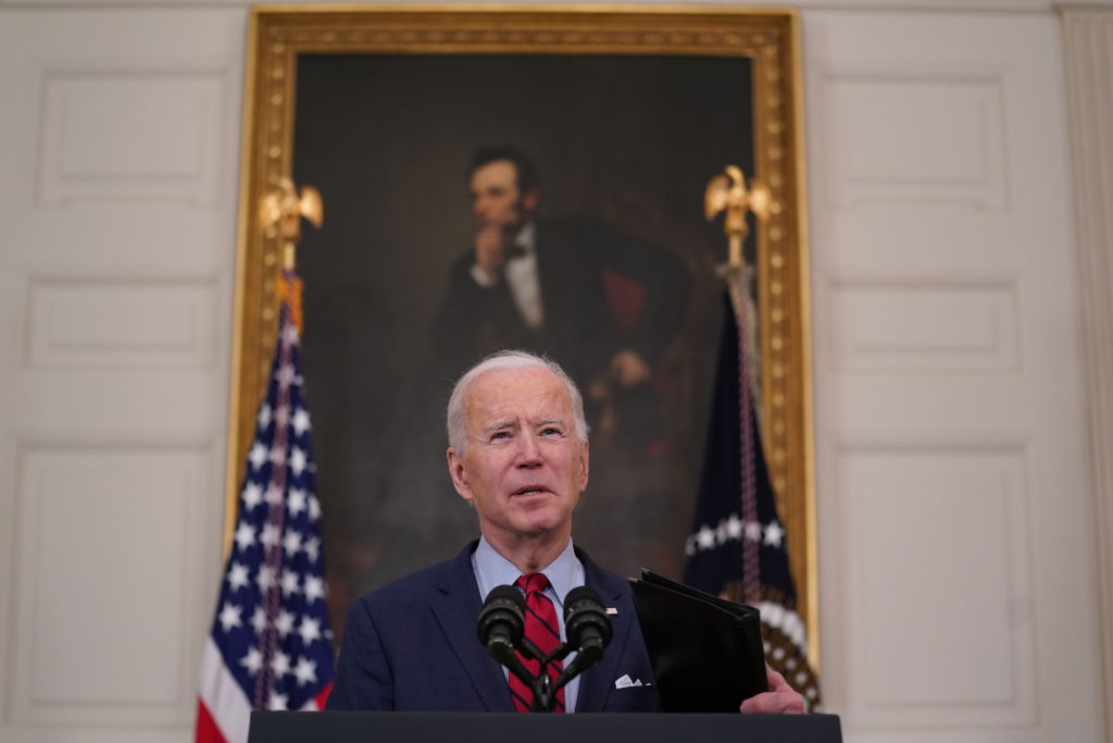 U.S. President Joe Biden speaks in the State Dining Room of the White House in Washington, D.C., on Tuesday, March 23, 2021, one day after a shooter killed 10 people in a supermarket in Colorado.