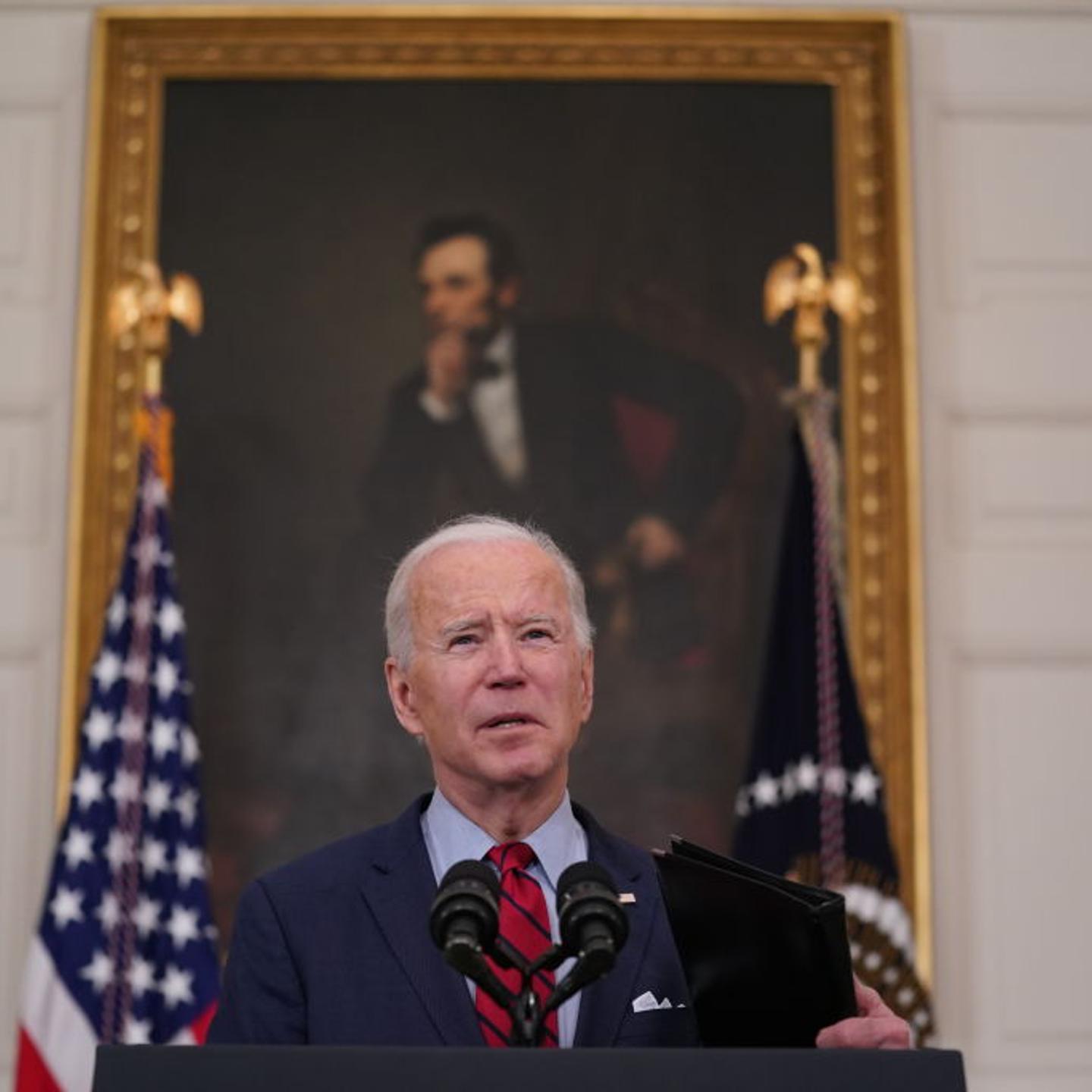 U.S. President Joe Biden speaks in the State Dining Room of the White House in Washington, D.C., on Tuesday, March 23, 2021, one day after a shooter killed 10 people in a supermarket in Colorado.