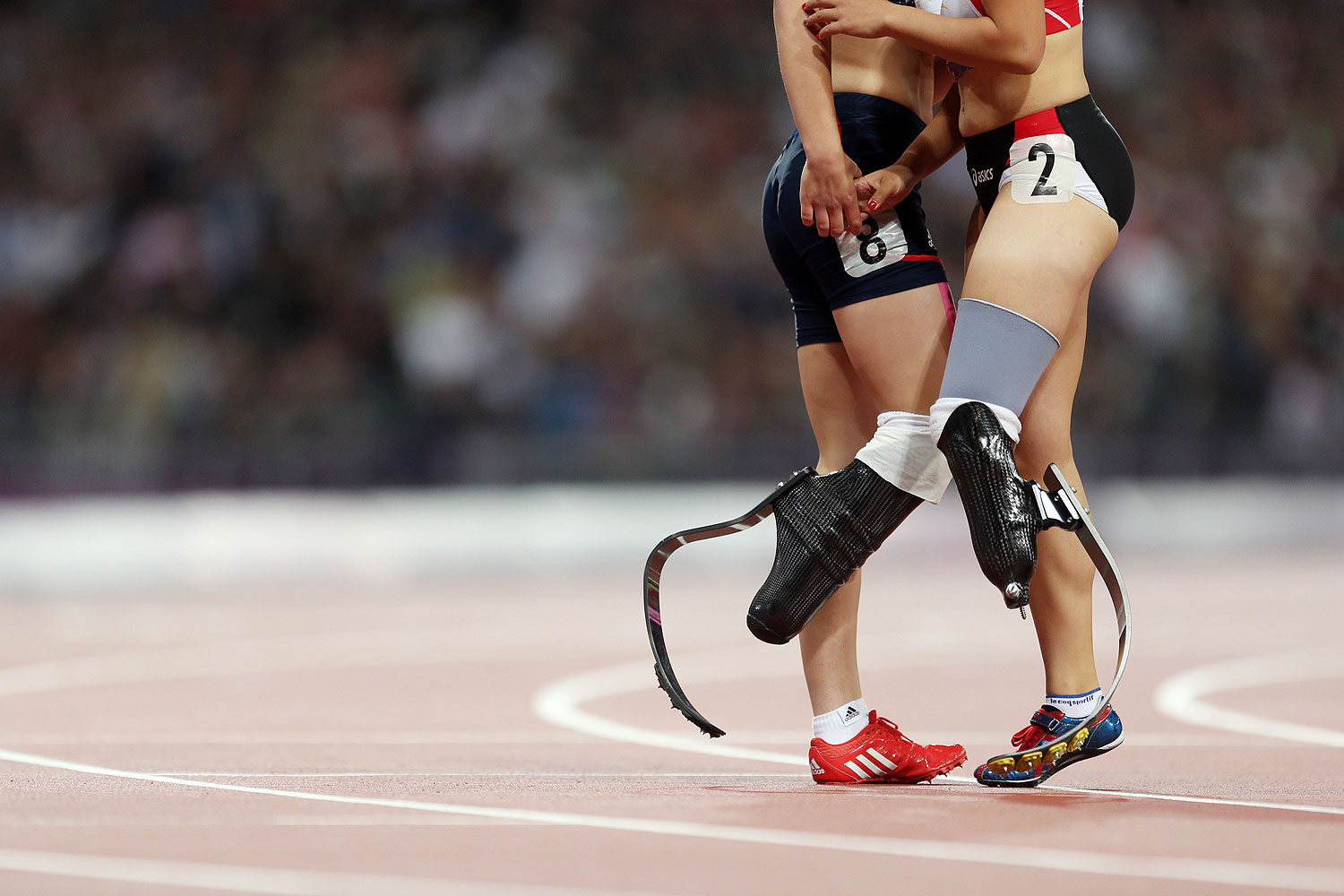 Sept. 6, 2012 Paralympics - London Great Britain's Sophie Kamlish and Japan's Saki Takakuwa after a race in the 2012 Paralympic Games in London