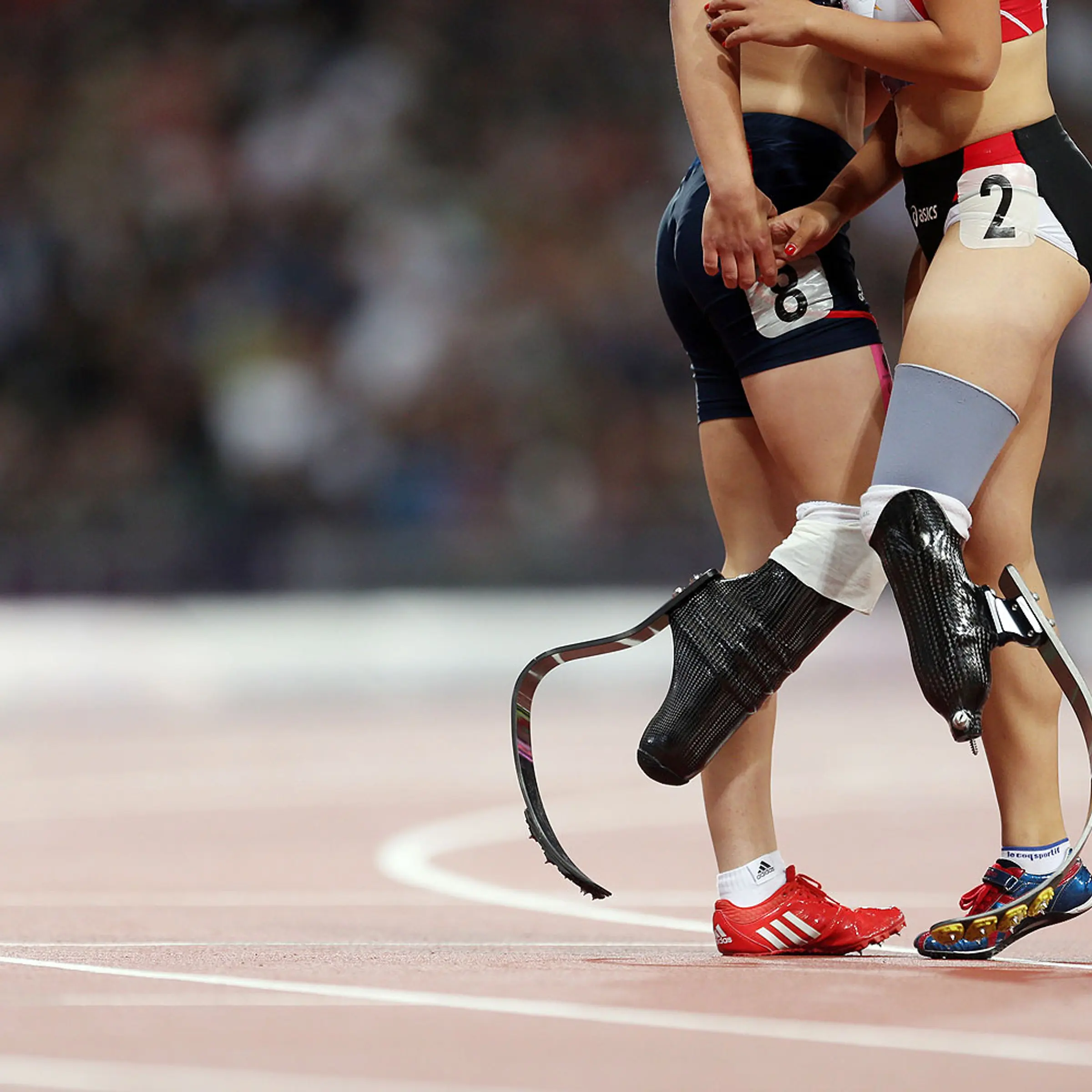 Sept. 6, 2012 Paralympics - London Great Britain's Sophie Kamlish and Japan's Saki Takakuwa after a race in the 2012 Paralympic Games in London