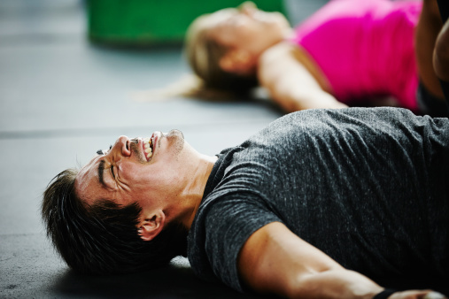 man-lying-gym